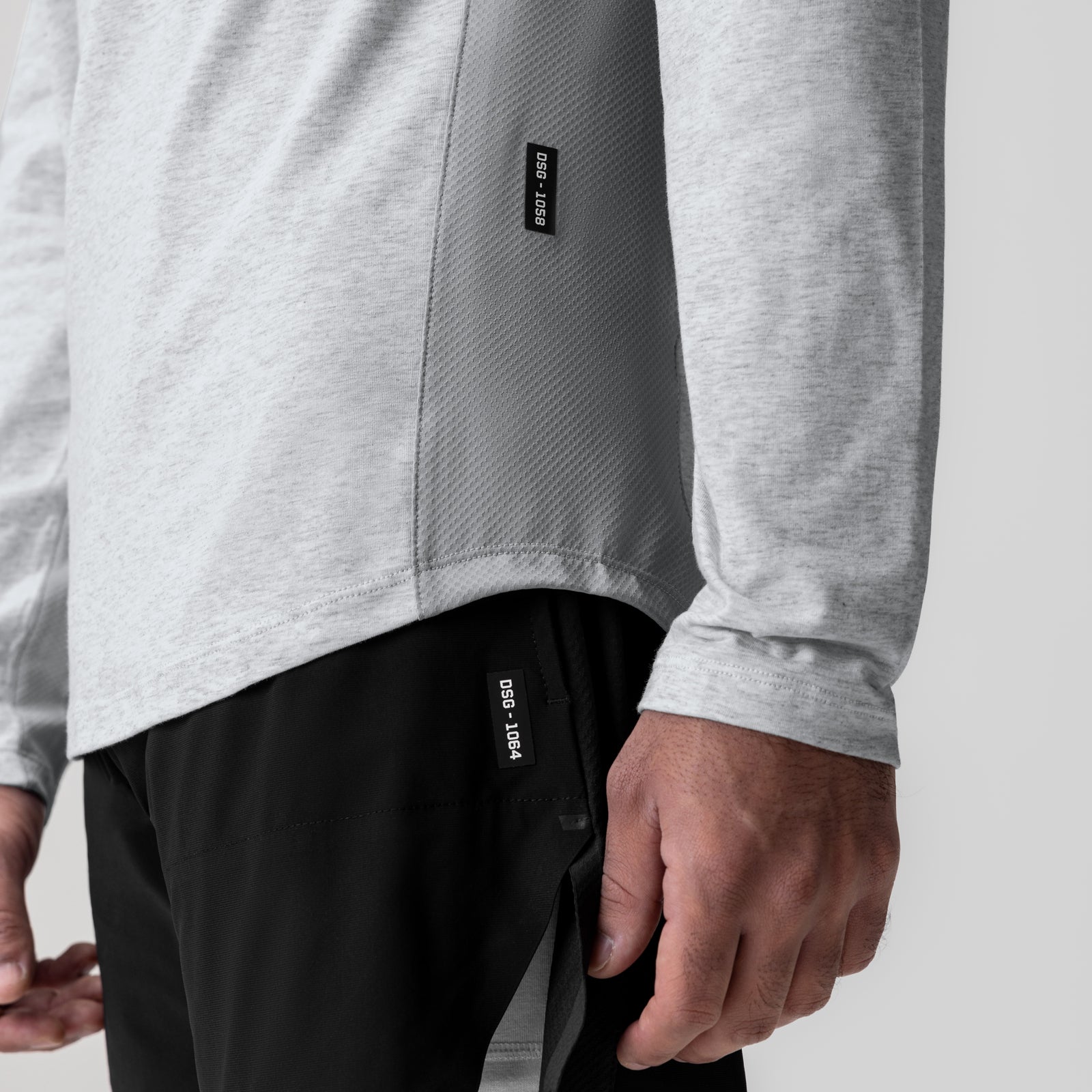 Heather grey long sleeve shirt on model, closeup of torso and sleeve detail