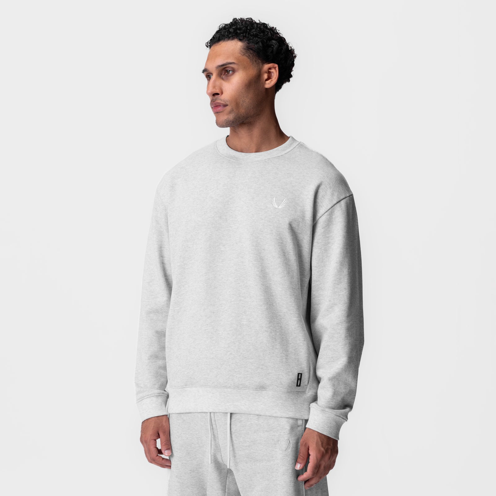 Herringbone Terry Crewneck in heather grey worn by model, front view