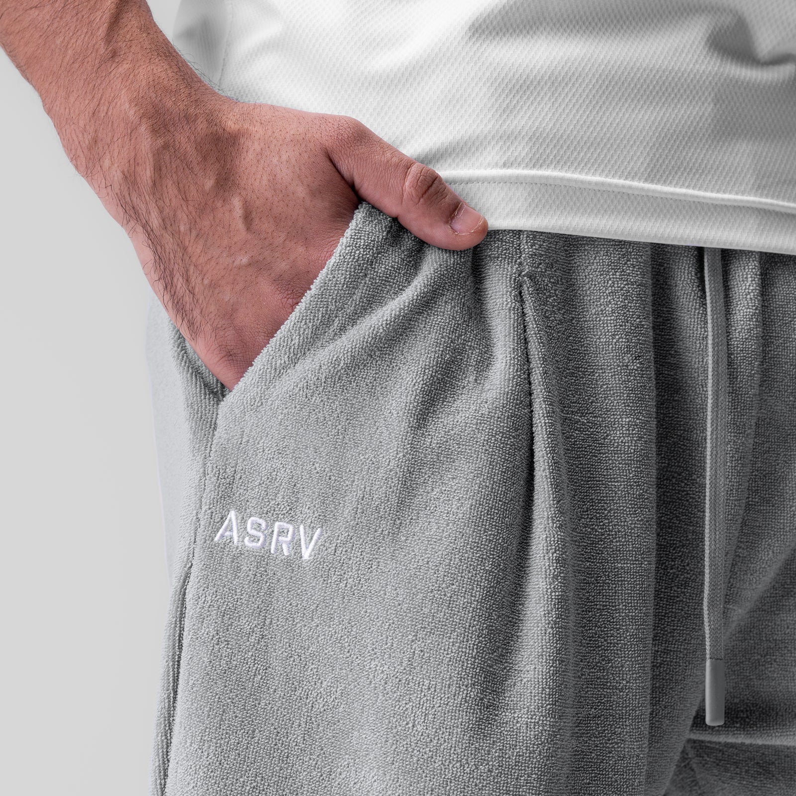 Towel Terry Relaxed Short in Heather Grey, worn with hand in pocket detail