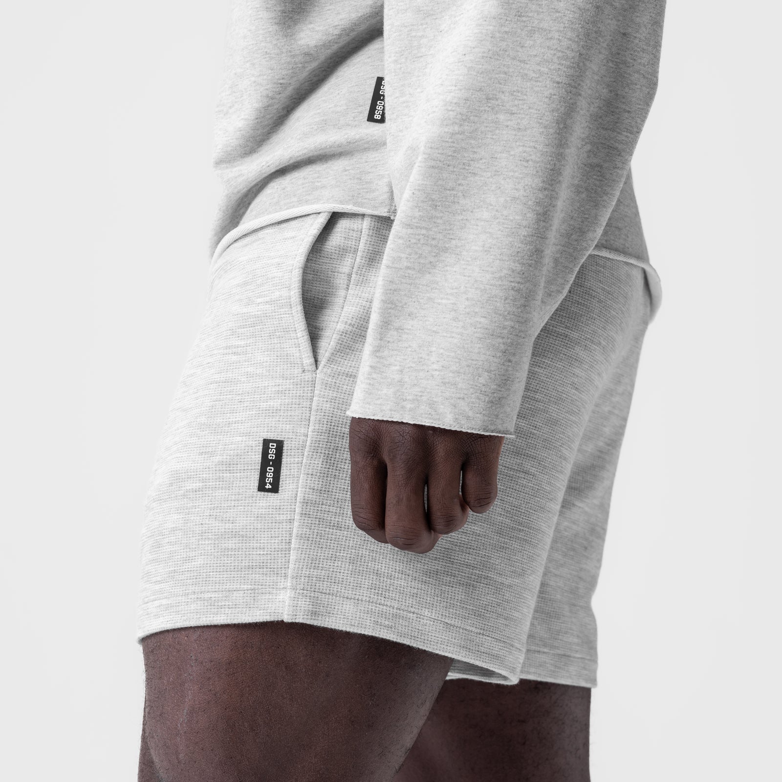 Waffle Knit Sweat Short in Heather Grey, worn with hand in pocket, side view