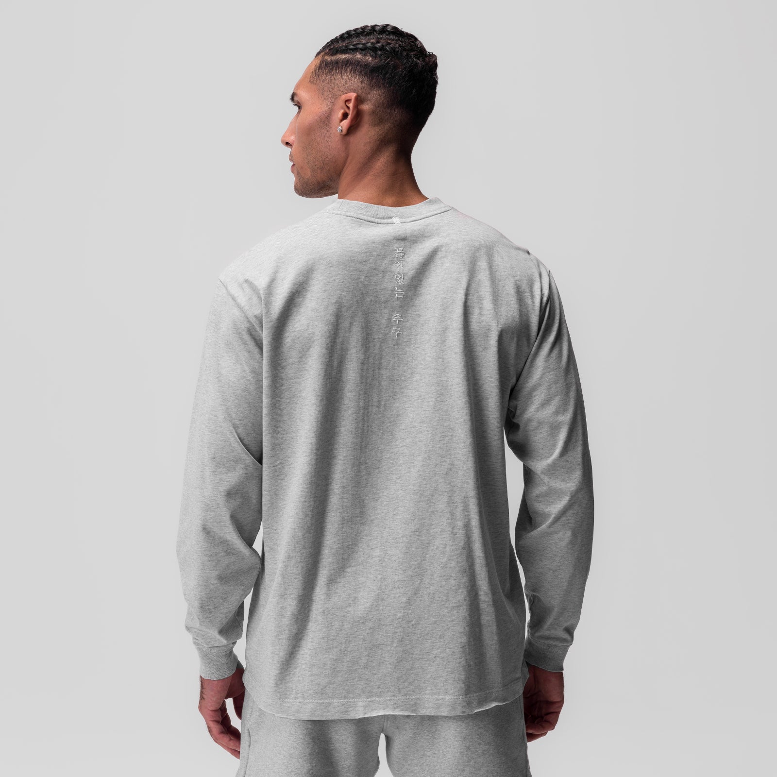 Tech Essential Relaxed Long Sleeve in Heather Grey, back view on model