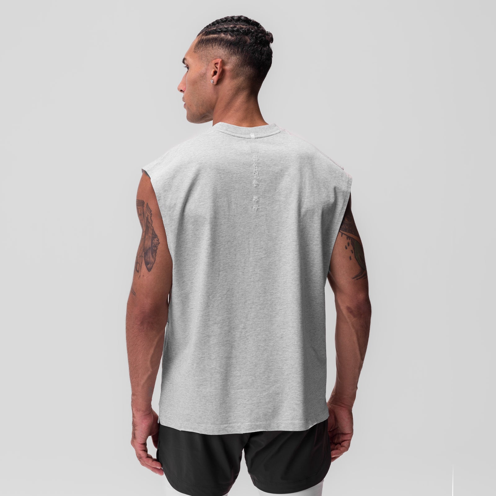 Tech Essential Rocker Cutoff sleeveless tank in heather grey, back view on model