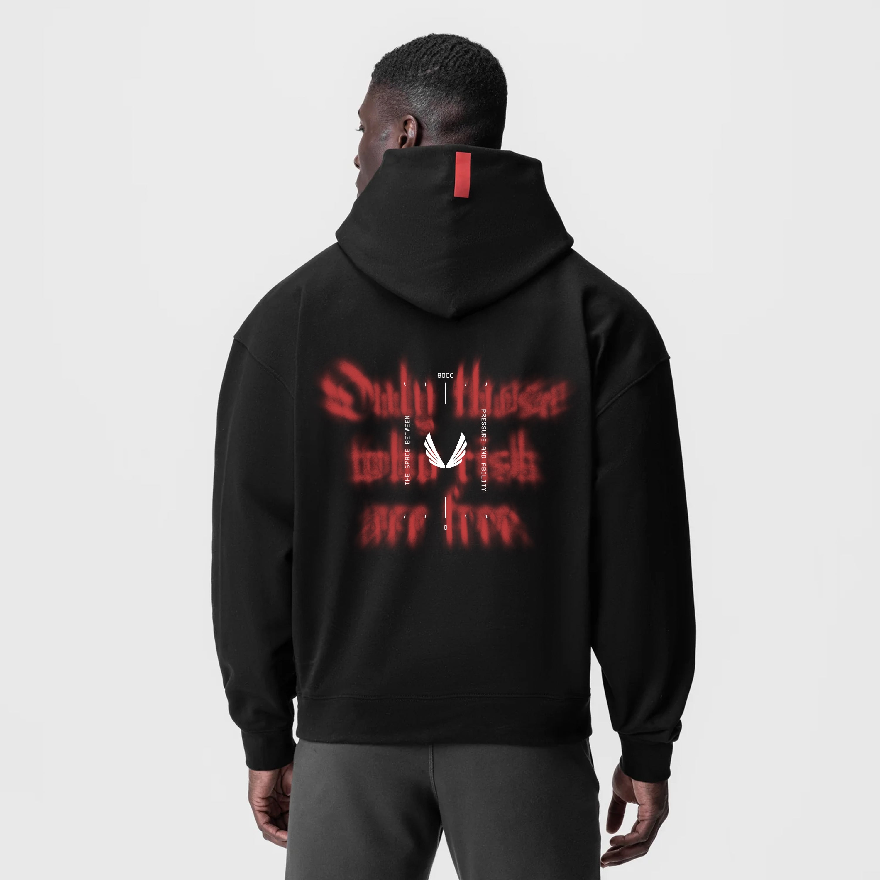 Tech-Terry Zip Pocket Hoodie in black with red graphic back print, worn by model