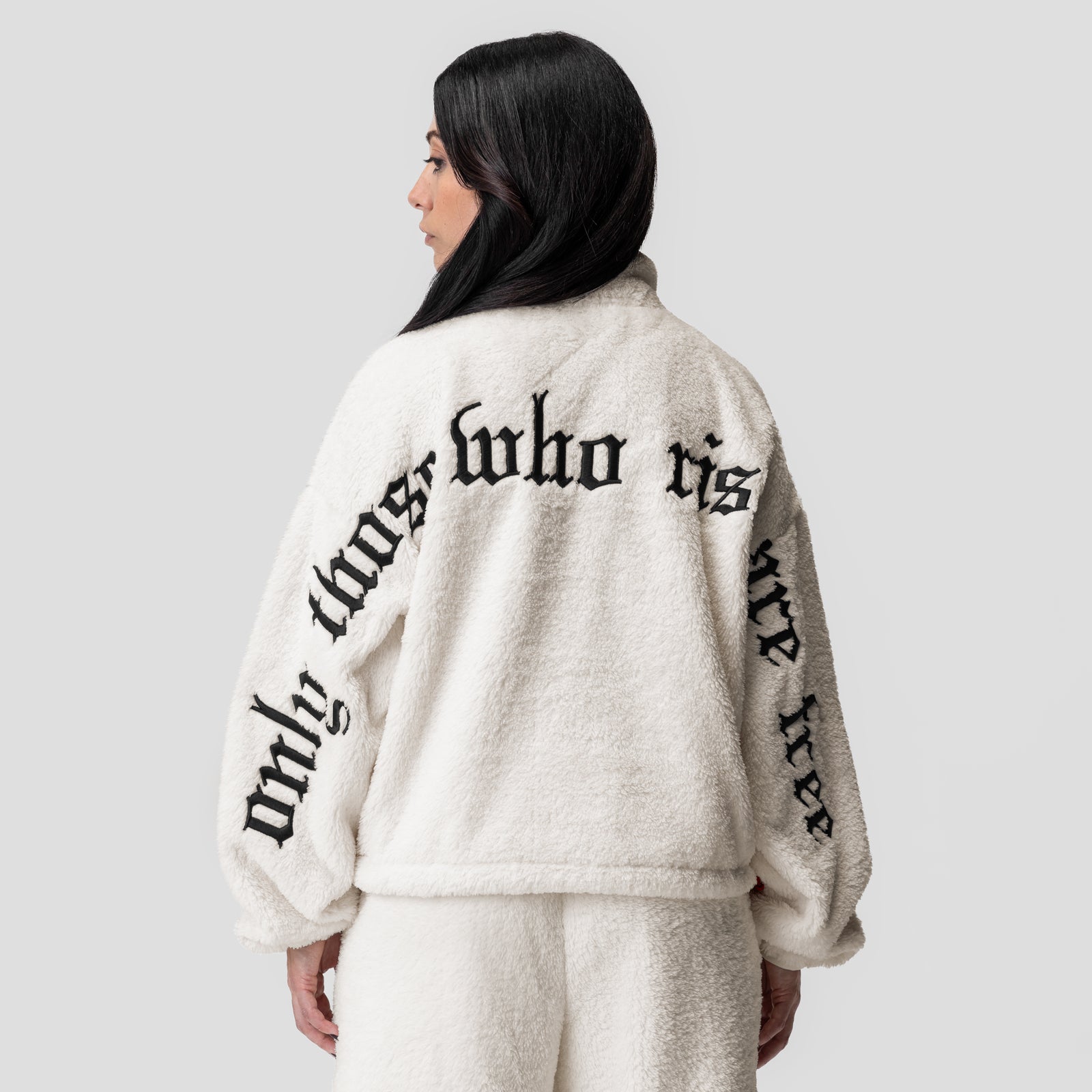 Women's Sherpa Recovery 1/2 Zip in ivory cream with black text, back view on model