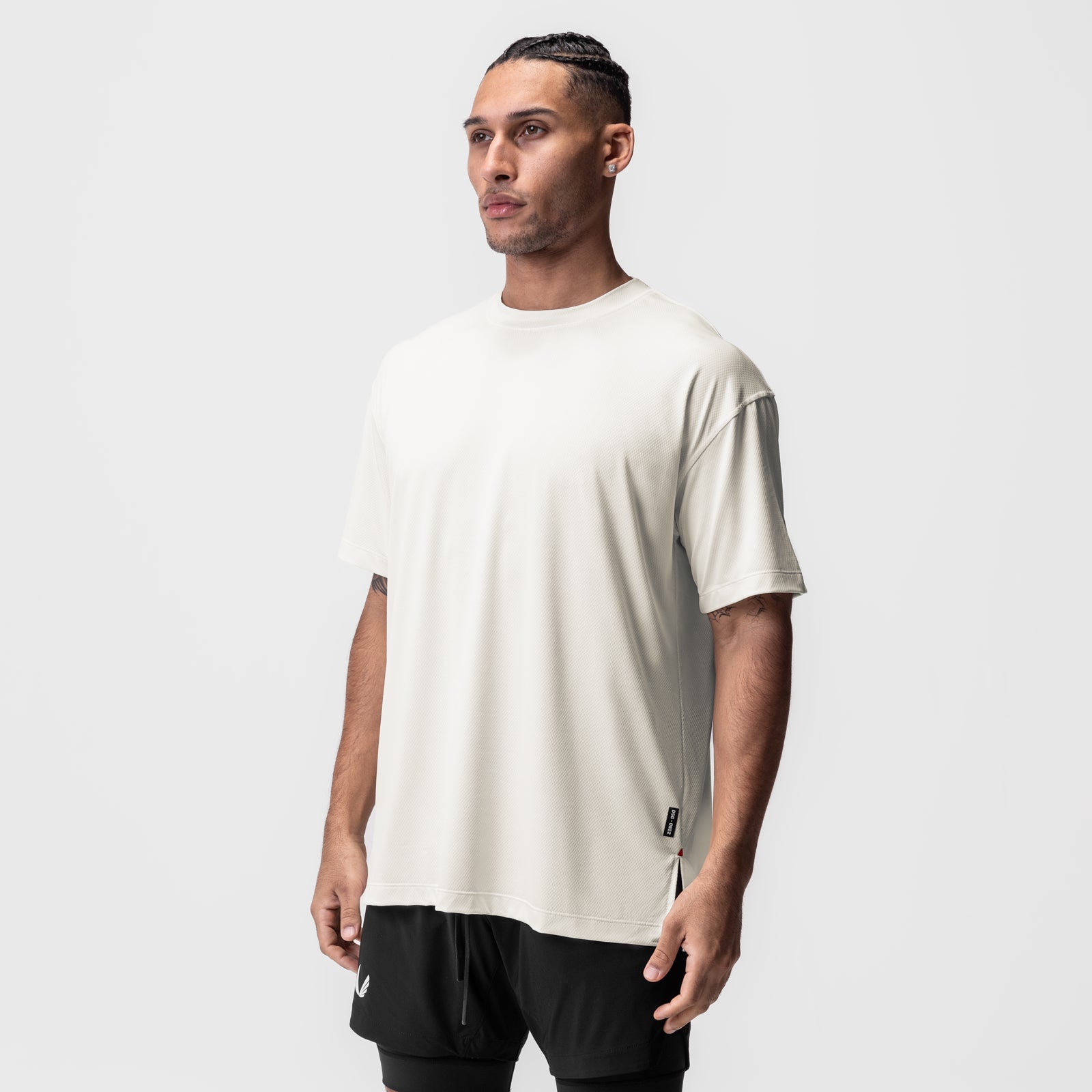 AeroSilver® Oversized Tee in ivory cream worn by male model, side profile view