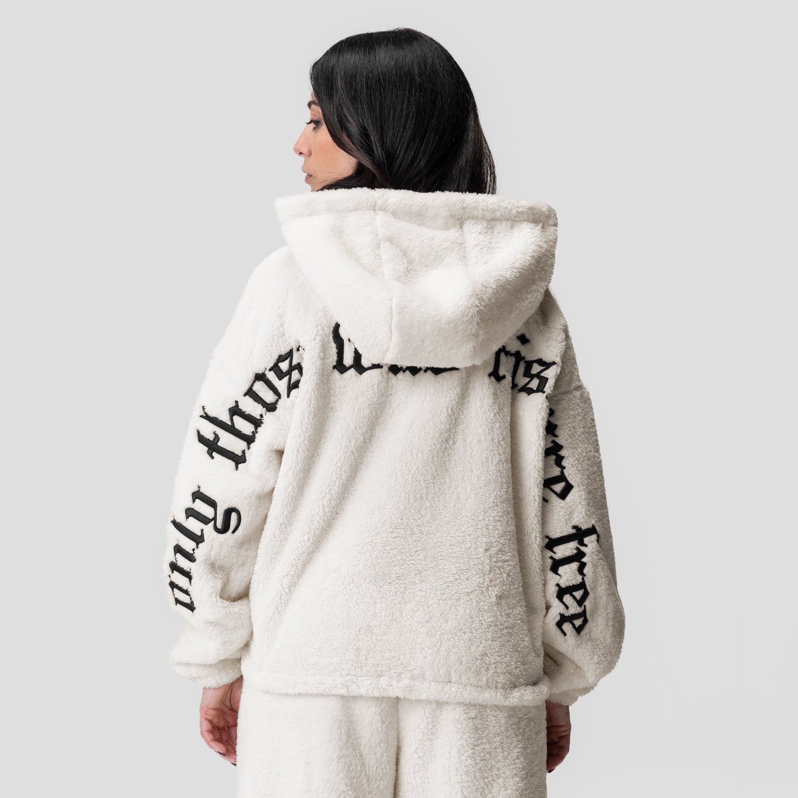 Women's Sherpa Recovery Full Zip Hoodie in ivory cream with black text, back view on model