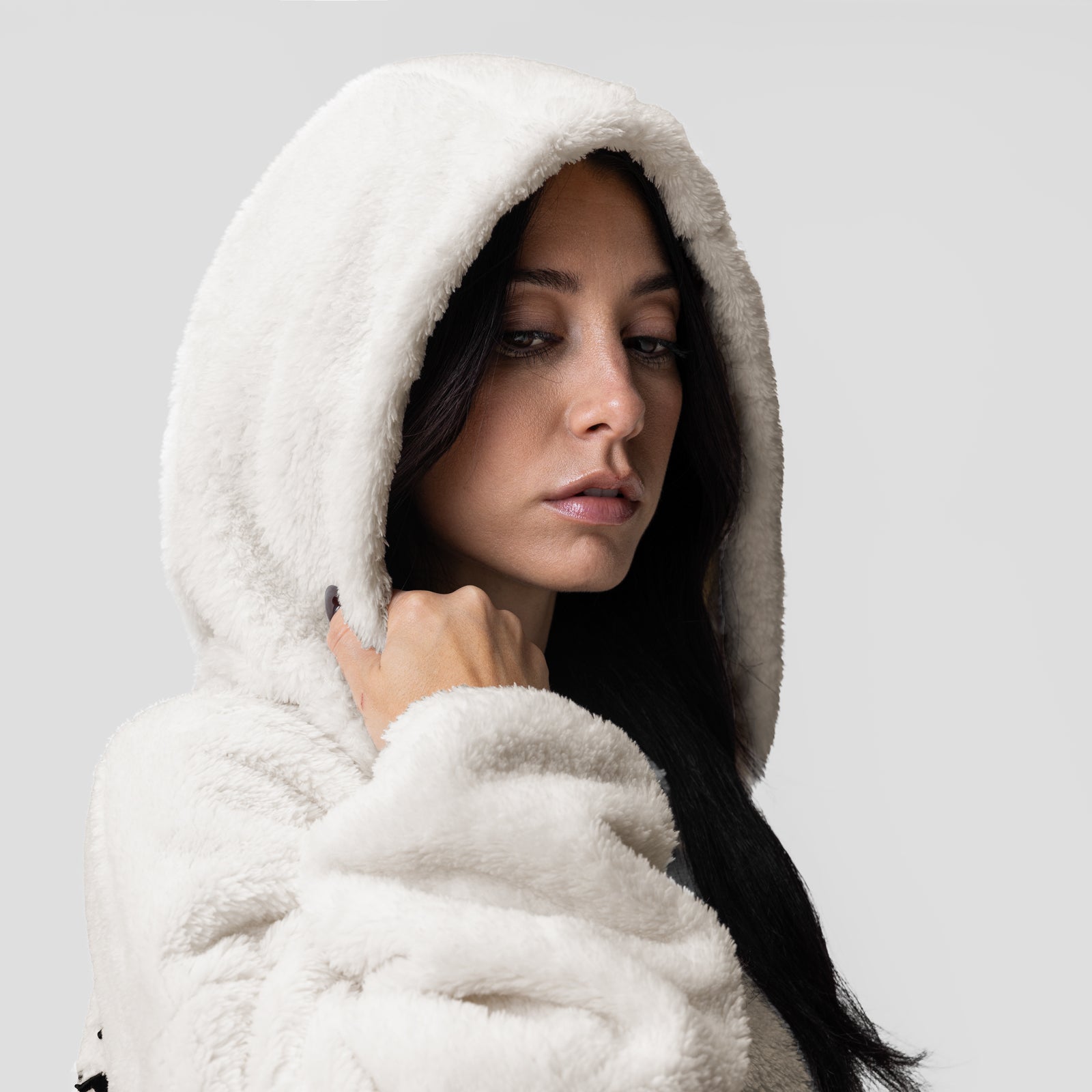 Women's Sherpa Recovery Full Zip Hoodie in Ivory Cream, worn by model in profile