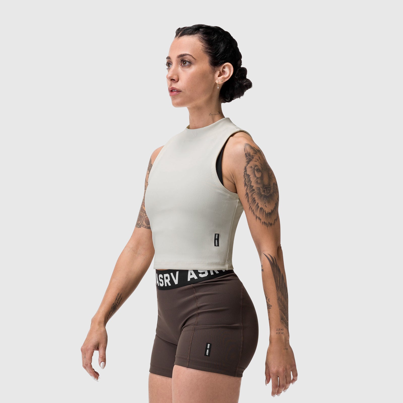 Lycra ribbed mockneck tank in ivory cream, side profile on model