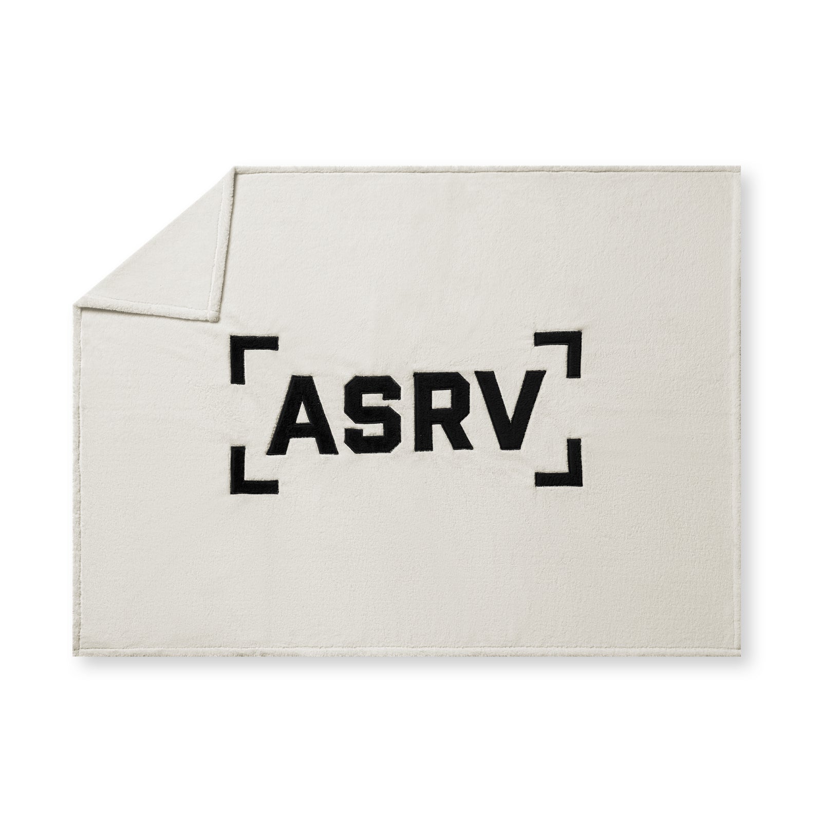 flatlay Sherpa Recovery Blanket in ivory cream with black ASRV logo, folded corner view