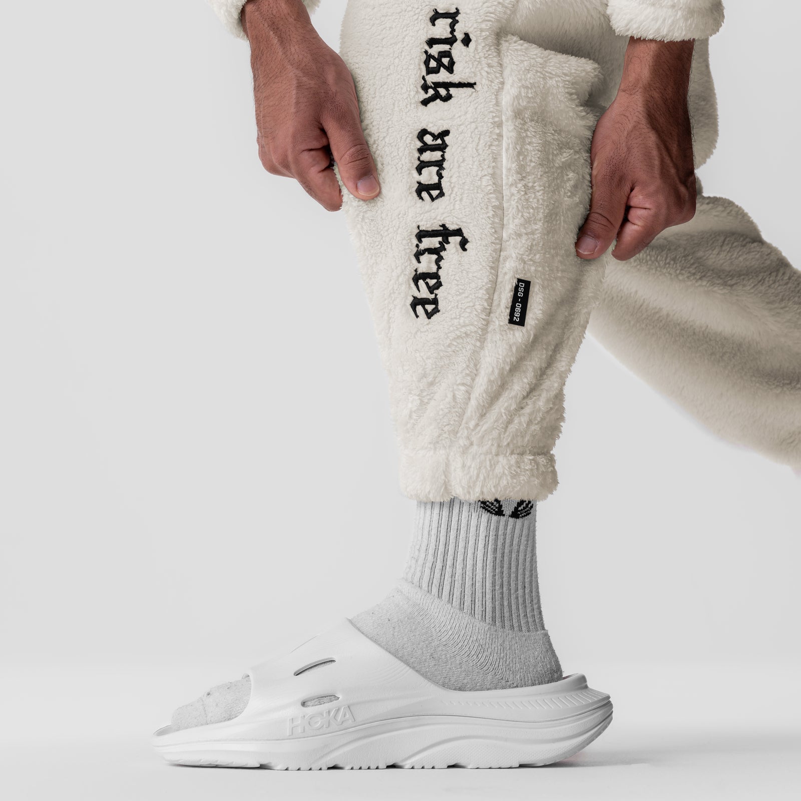 Sherpa Recovery Sweats in ivory cream worn by model, detail shot of leg and foot