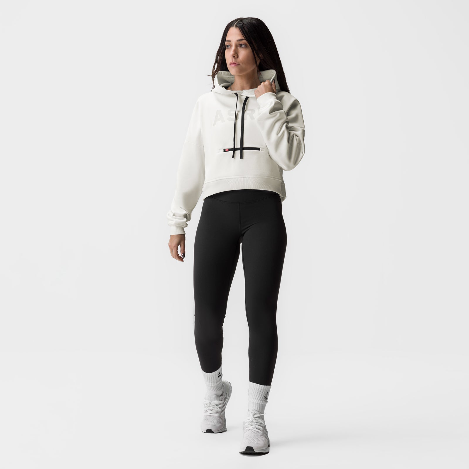 Ivory cream cropped hoodie worn with black leggings and white socks, front view