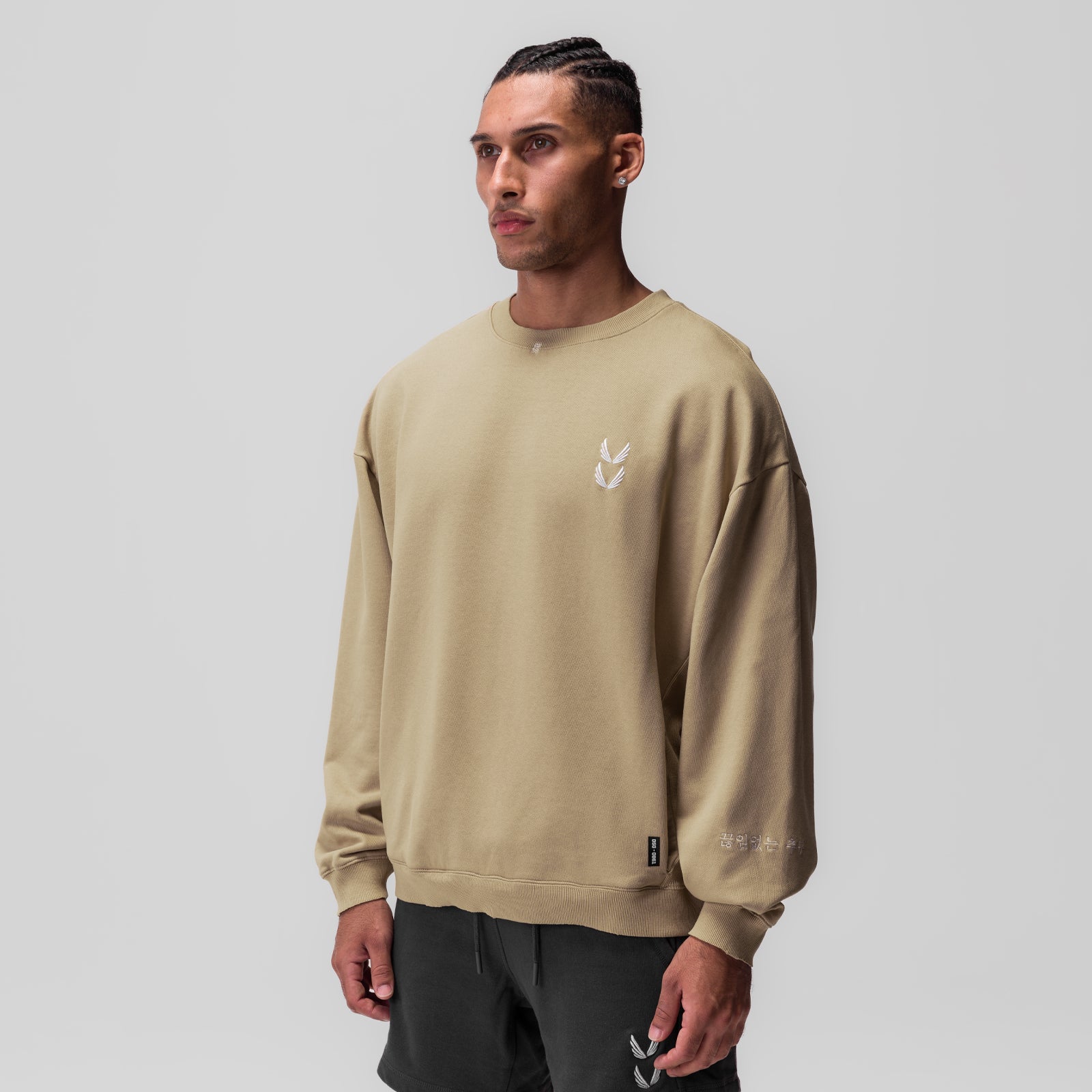 Tech Essential Distressed Crewneck in khaki worn by model, front view