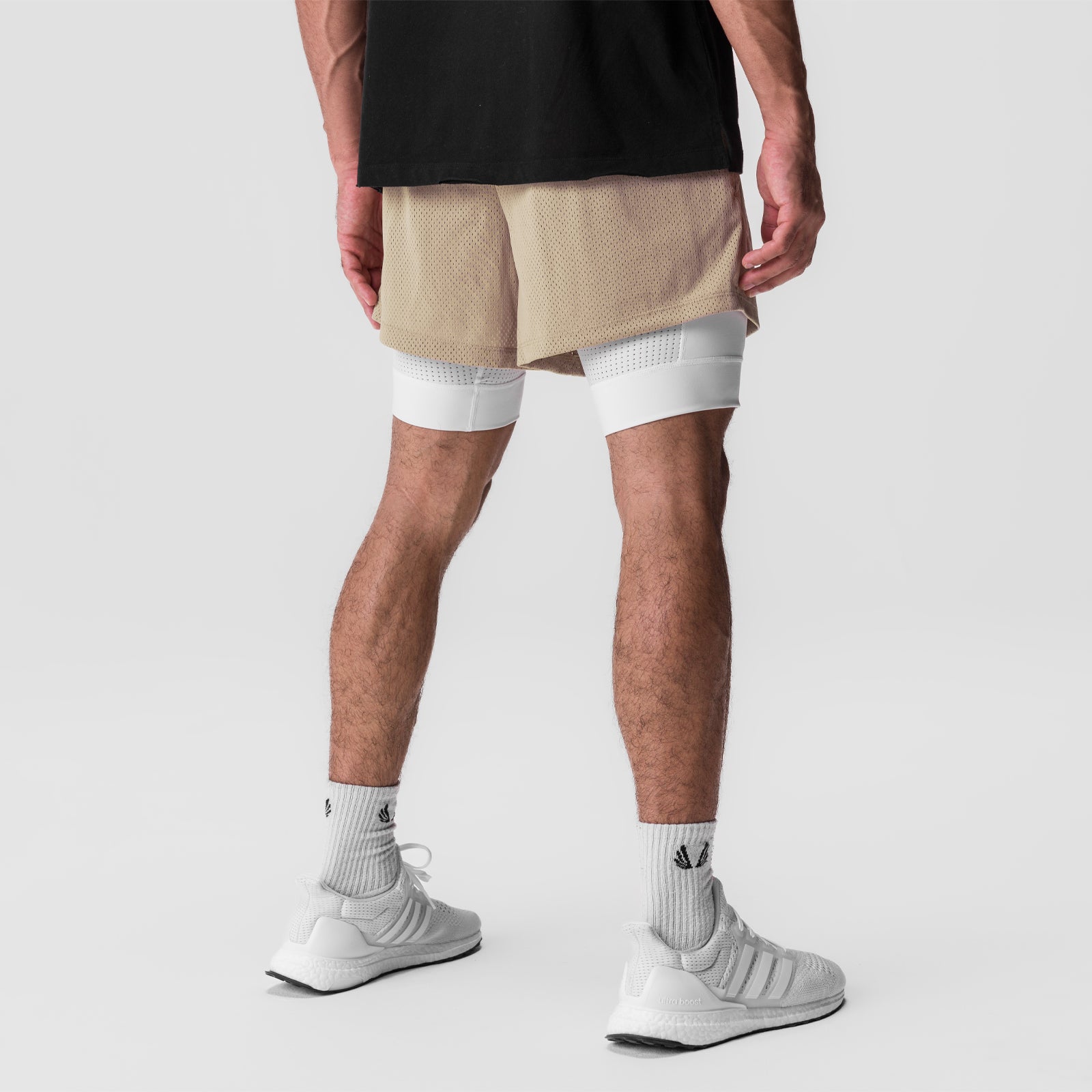 SilverPlus™ Mesh 5" Liner Short in khaki and white, back view on model