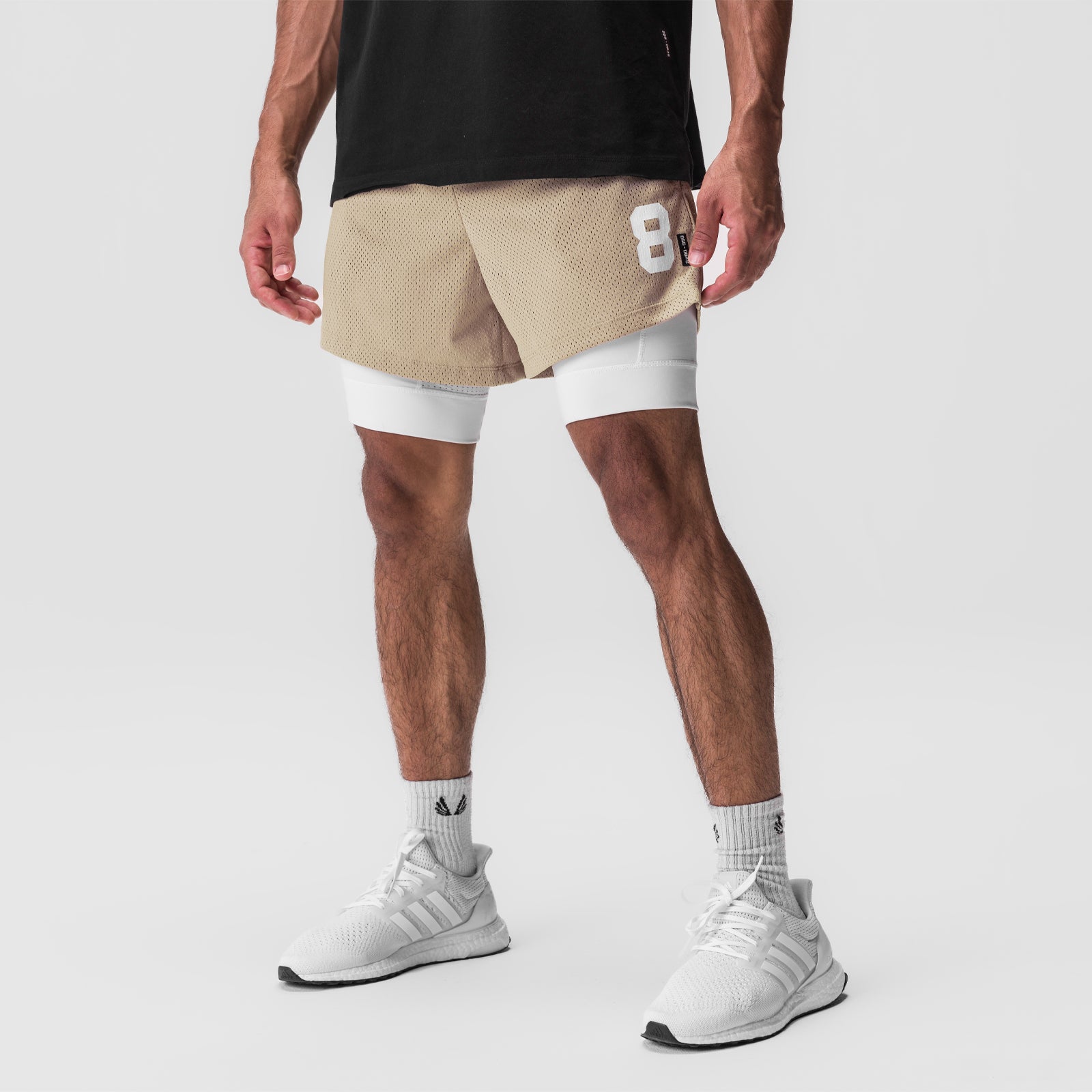 SilverPlus Mesh 5" Liner Short in khaki and white, worn by model with white sneakers