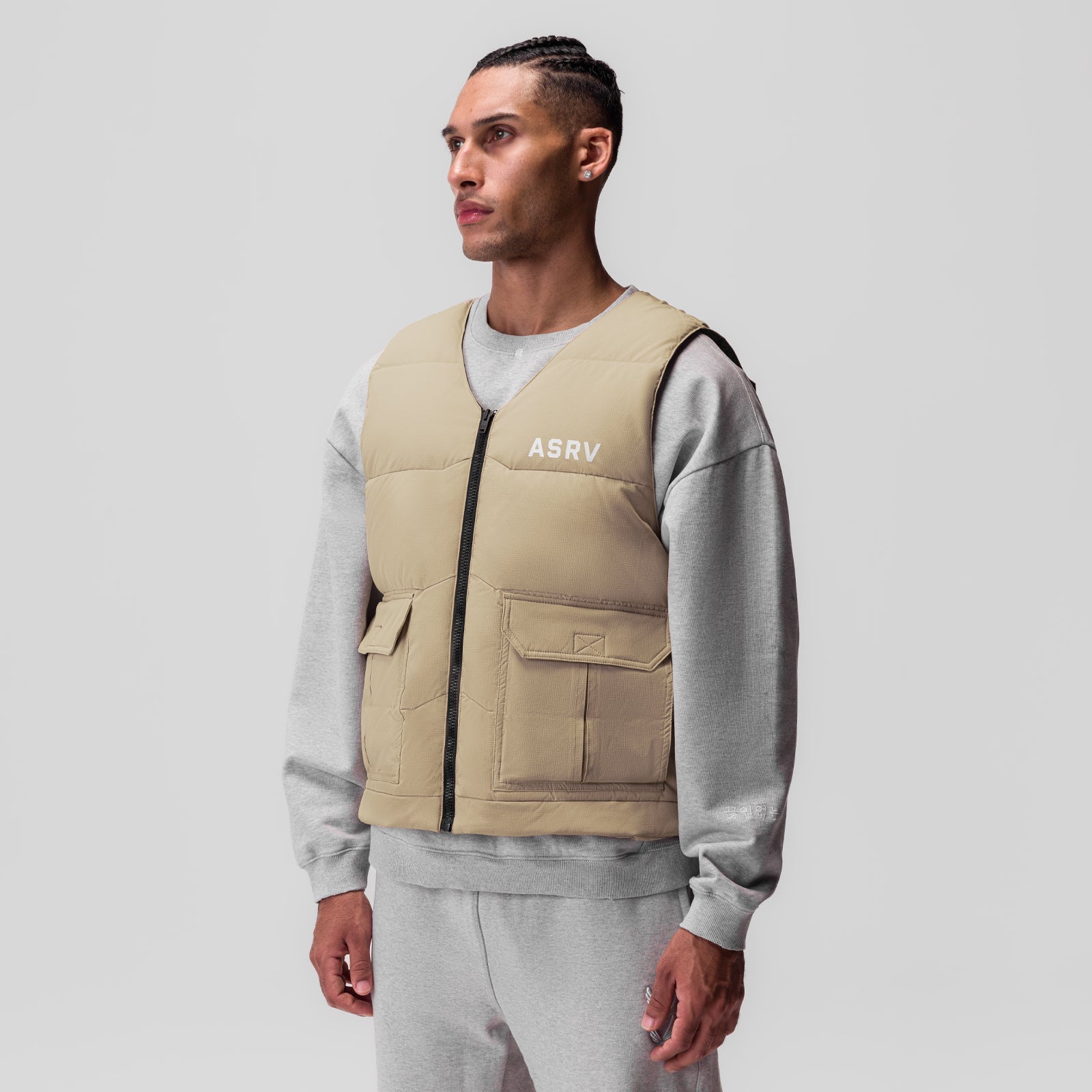 Ripstop Insulated Puffer Gilet in khaki worn over grey sweatshirt, front view