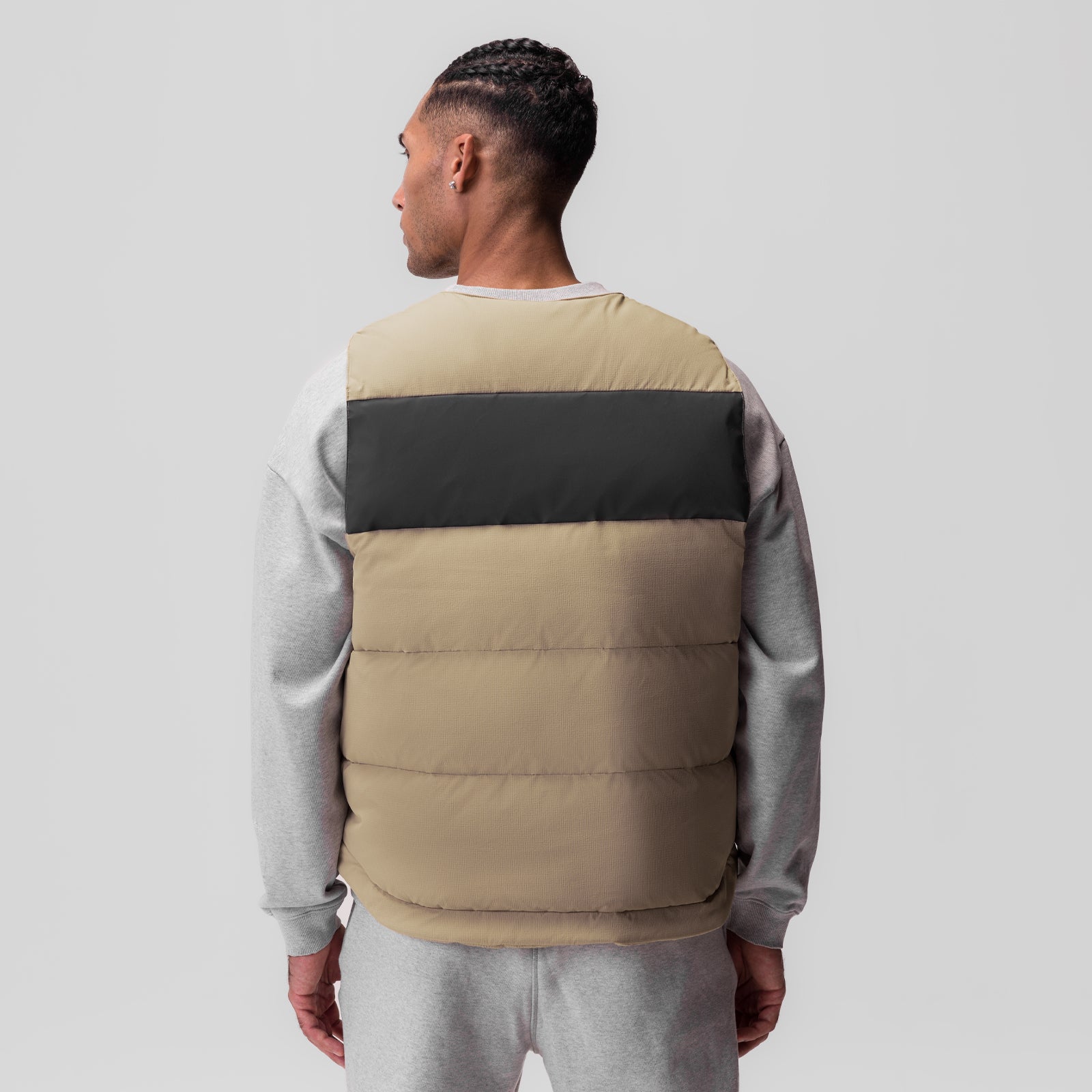 Ripstop Insulated Puffer Gilet in khaki and black, worn by model, back view
