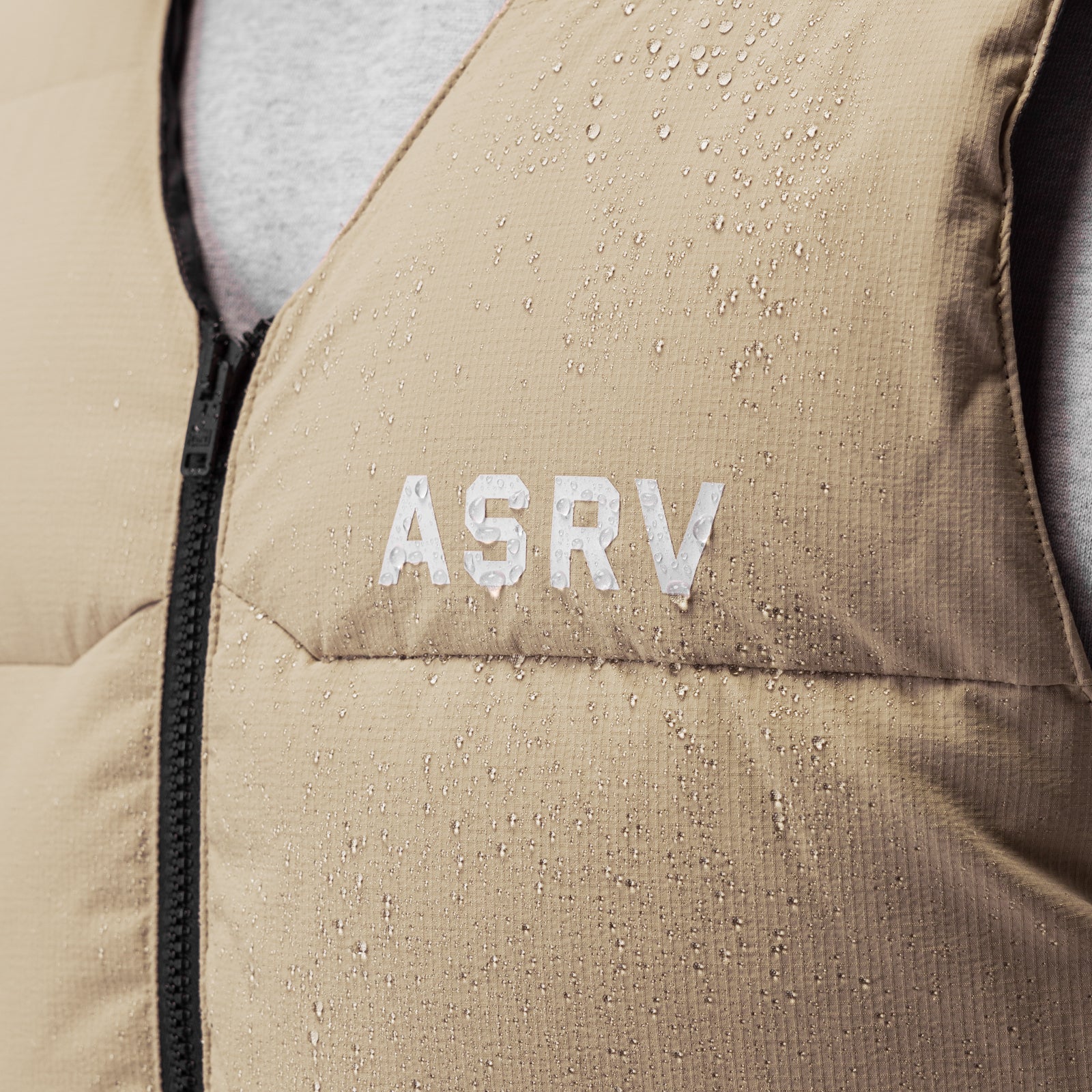 Ripstop Insulated Puffer Gilet in khaki worn on model, water-beaded fabric detail