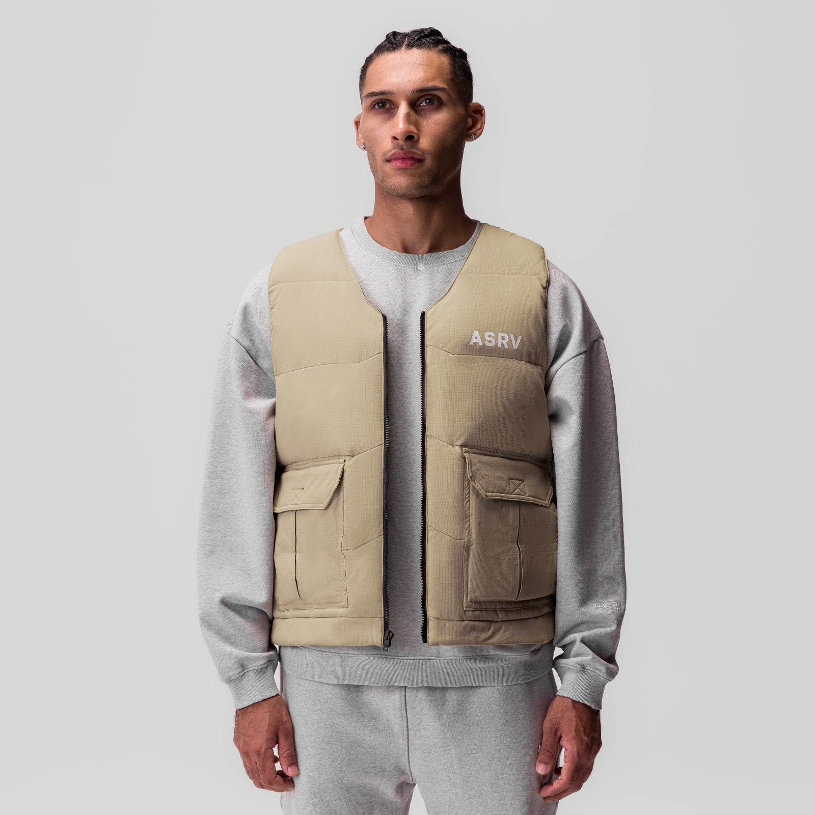 Ripstop Insulated Puffer Gilet in khaki worn over grey hoodie, front view on model
