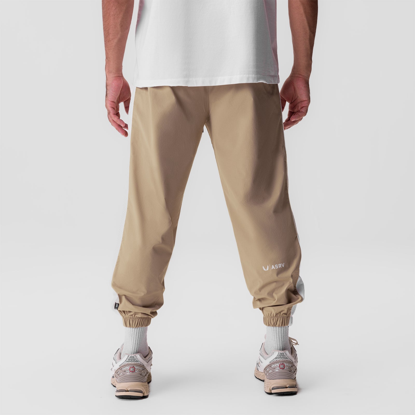 Ripstop Oversized Track Pant in khaki, back view on model wearing white tee and sneakers