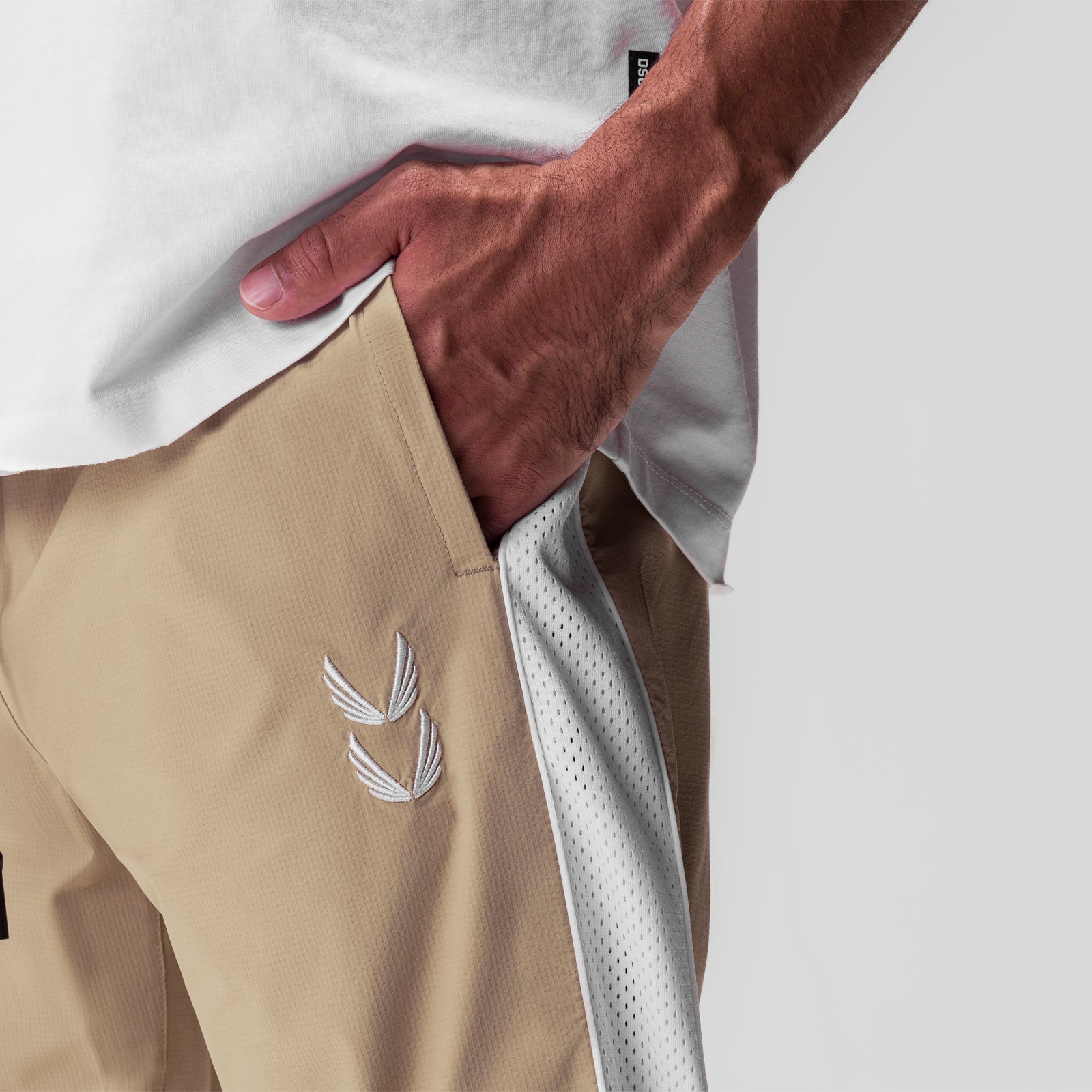 Ripstop Oversized Track Pant in khaki, worn with hand in pocket detail