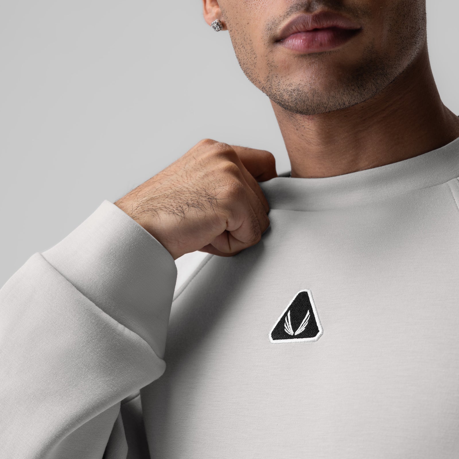 Dri-Core™ Oversized Crewneck in light grey, worn by model showing chest logo detail