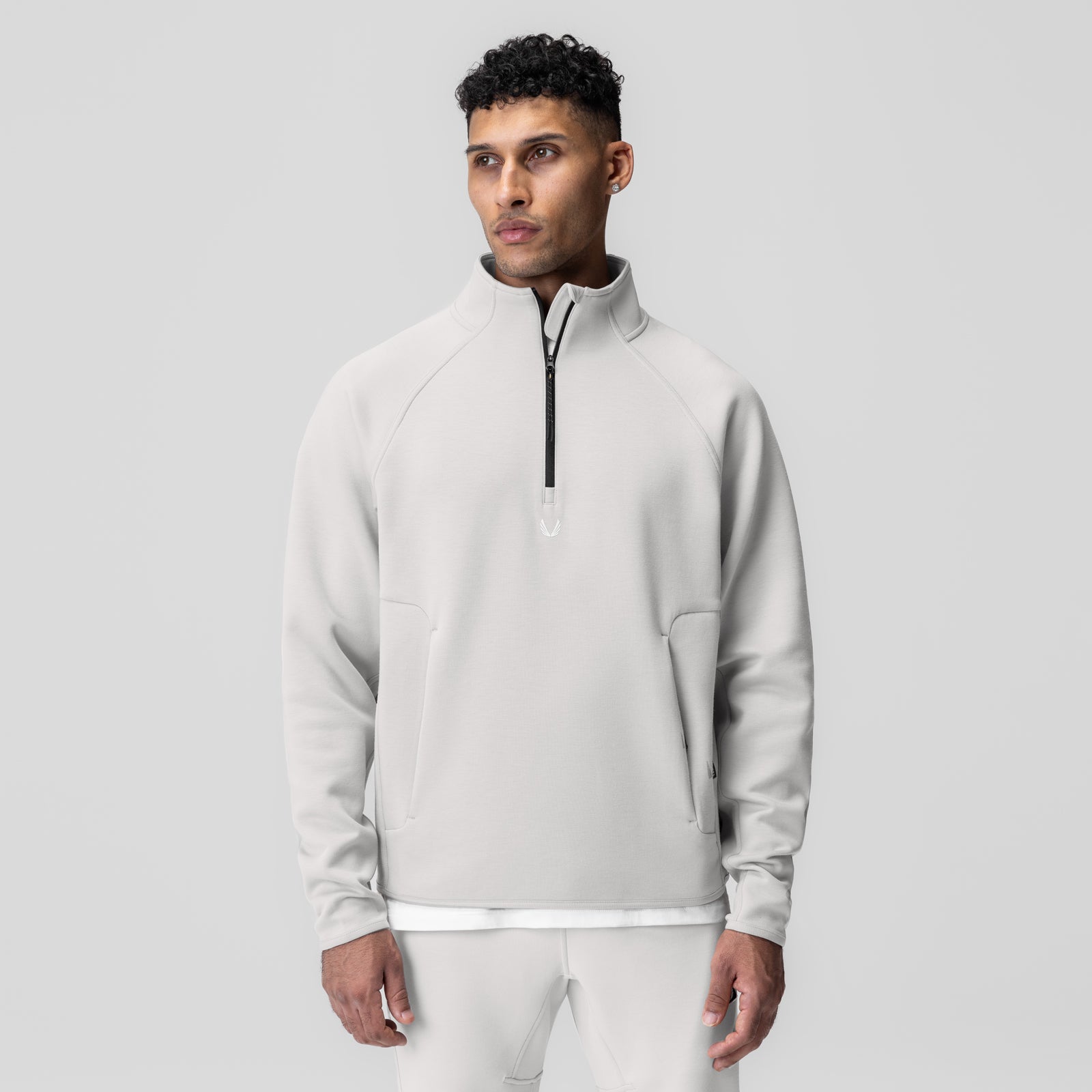 Dri-Core Quarter Zip in light grey, worn by model, front view