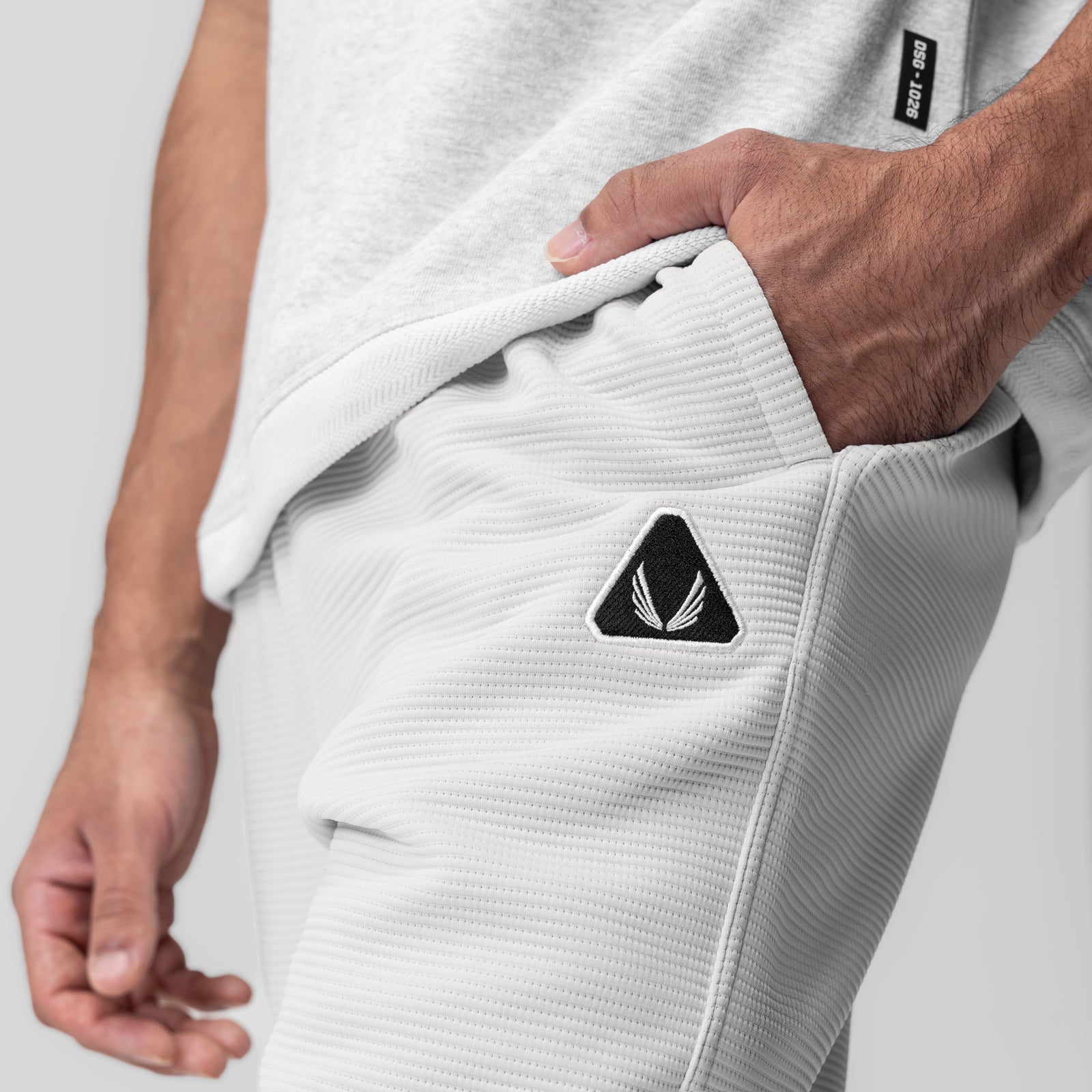 Deltapeak® Straight Leg Sweats in light grey worn by model, showing pocket detail and fit