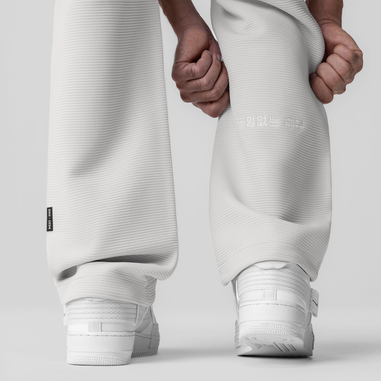 Deltapeak Straight Leg Sweats in light grey, model wearing full length view with white sneakers