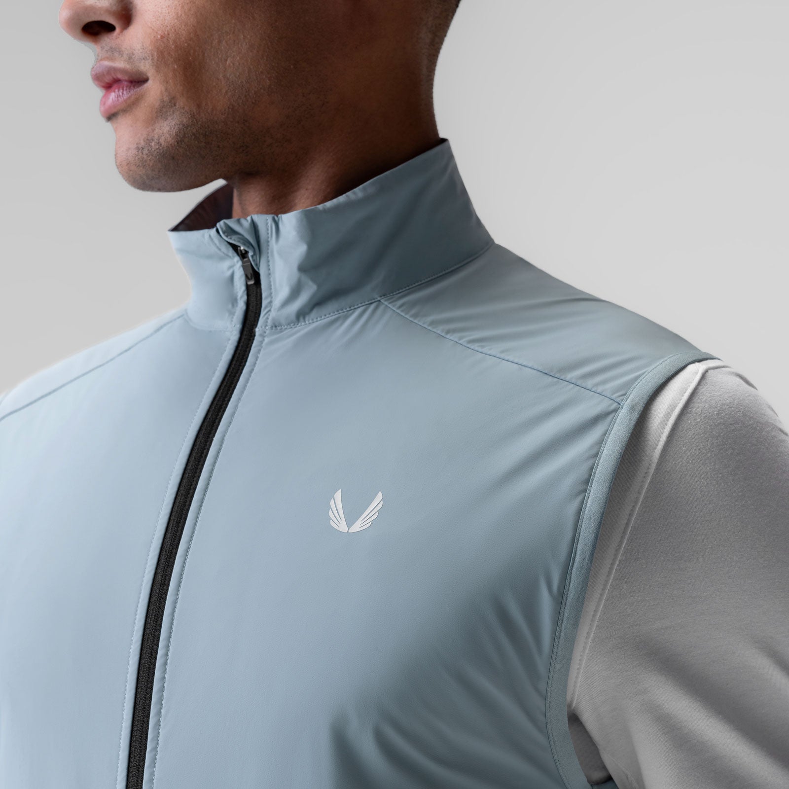Aerotex™ PrimaLoft® Run Vest in Light Sky, worn by model, side view