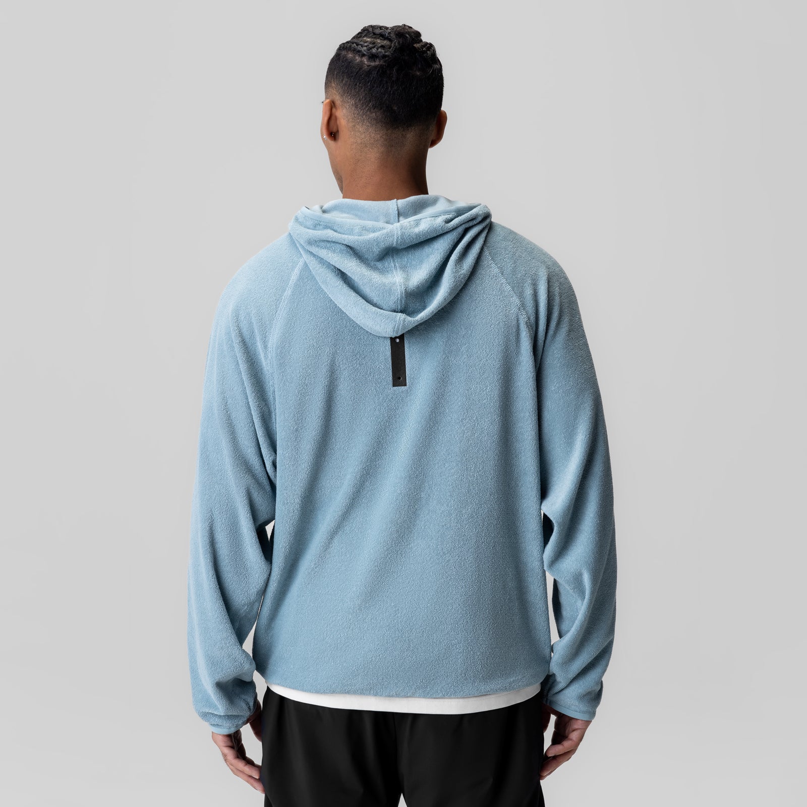 Light Sky Towel Terry Reversible Hoodie worn by model, back view