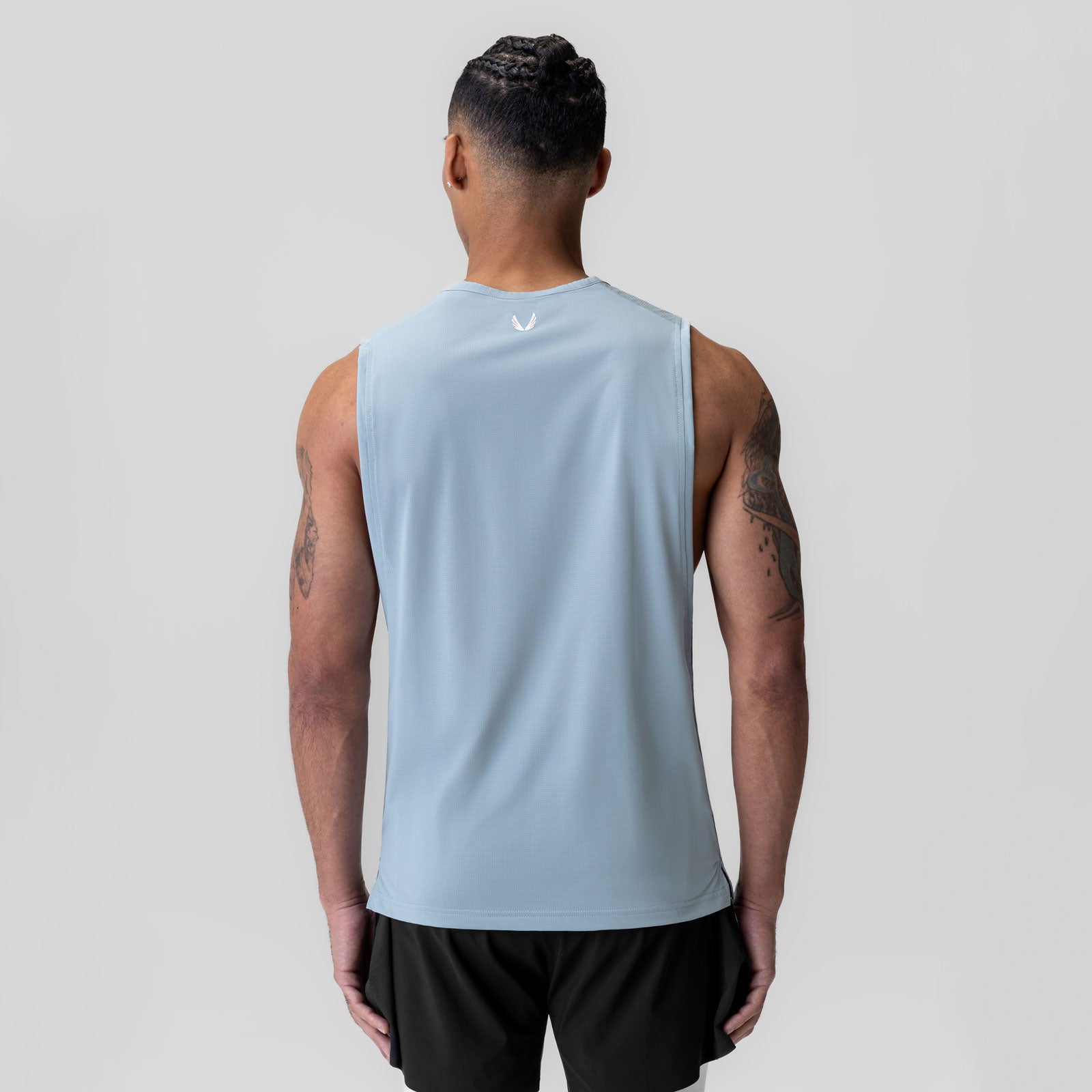 Ice-Skin™ Muscle Tank in light sky, back view on model