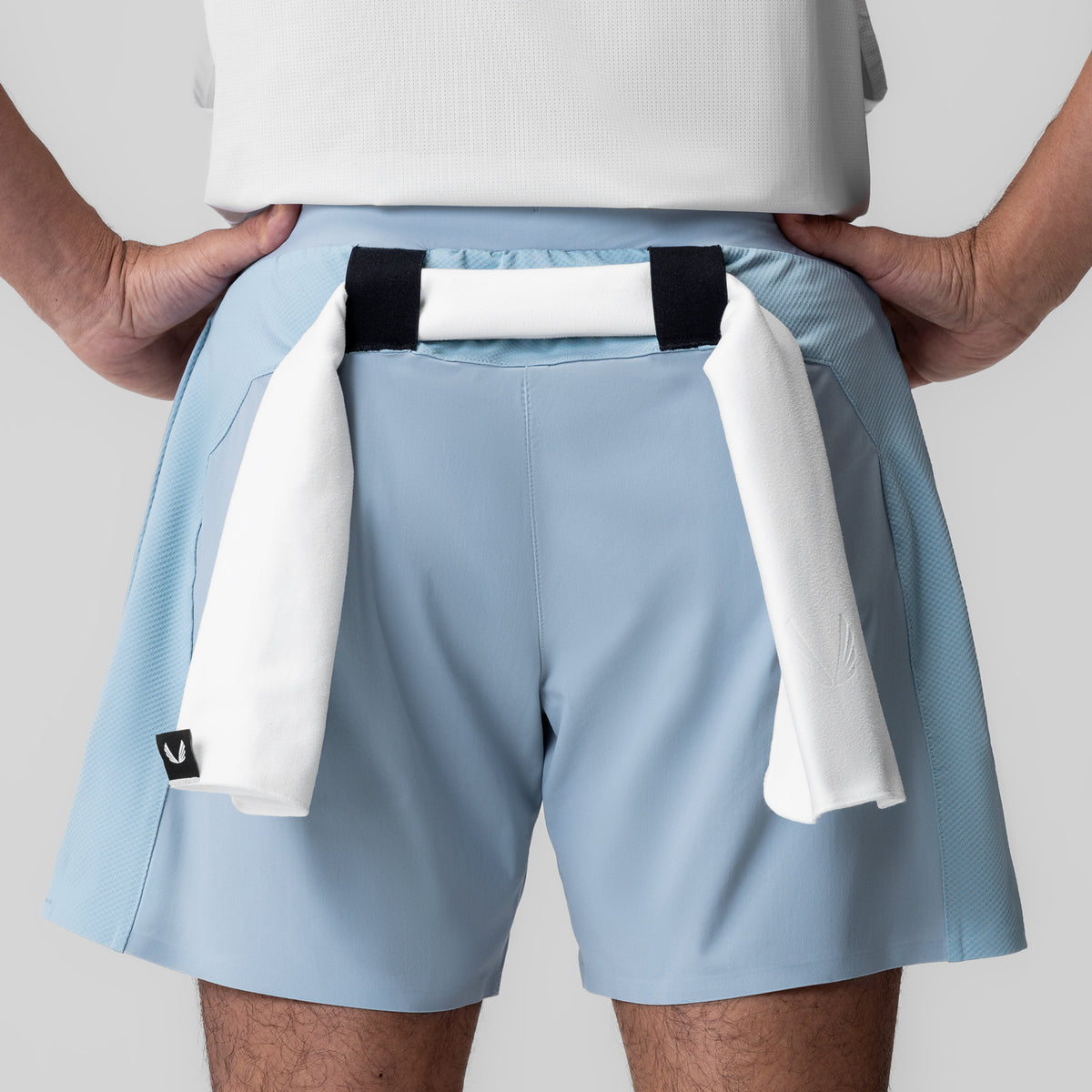 Tetra-Lite Bonded Training Short in light sky, worn by model with towel detail