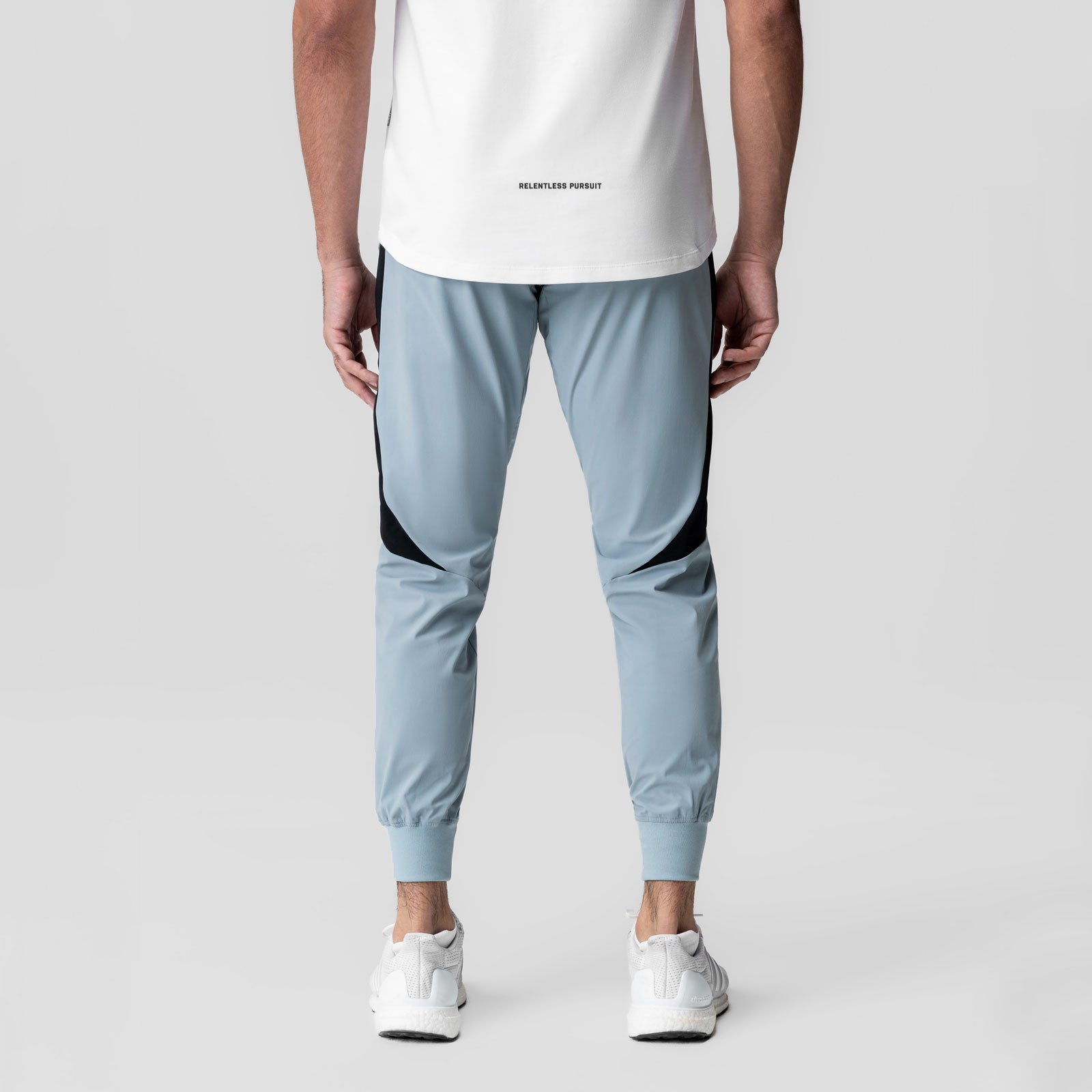 Tetra-Lite Cuffed Training Jogger in light sky, back view on model