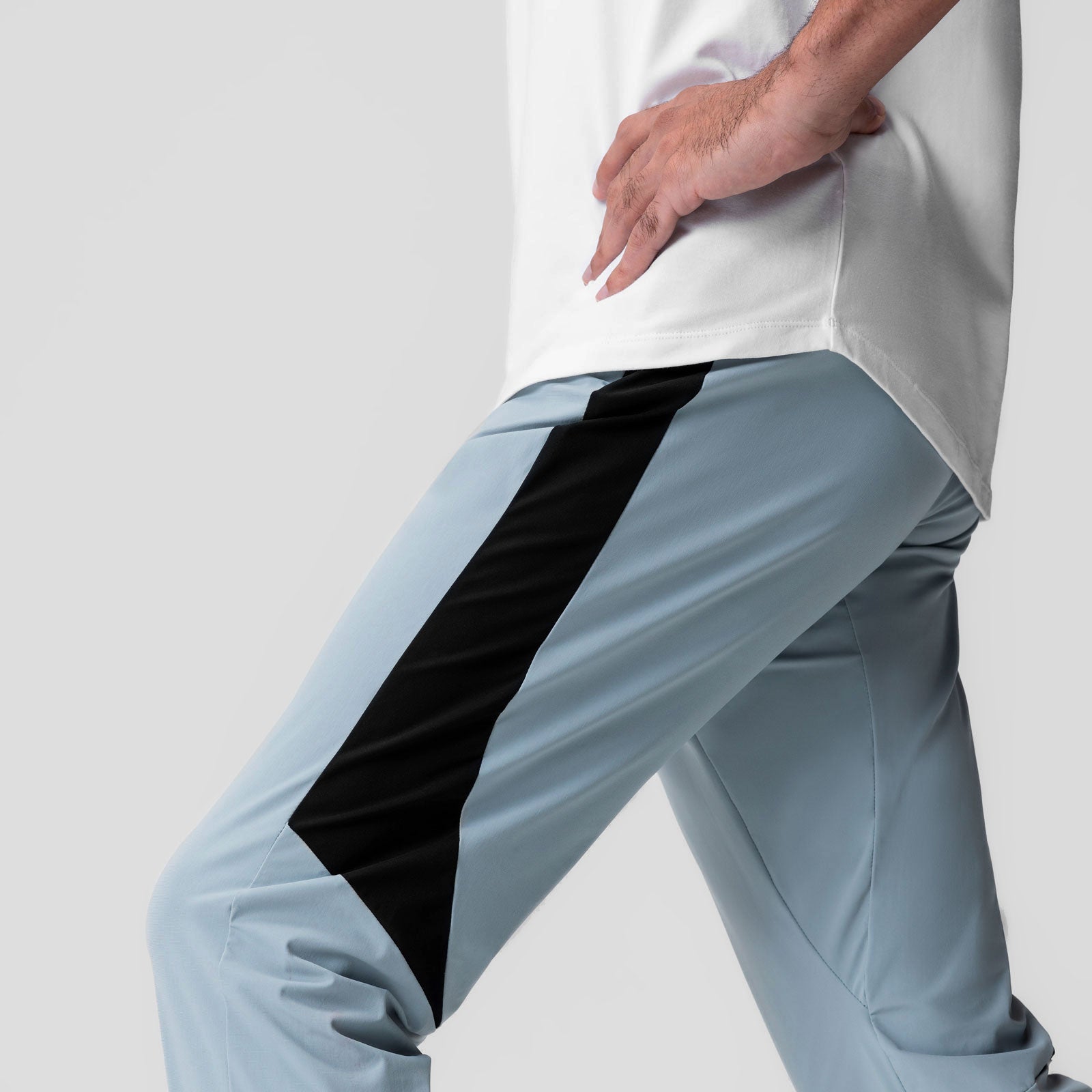Tetra-Lite Cuffed Training Jogger in light sky, worn by model showing side pocket detail