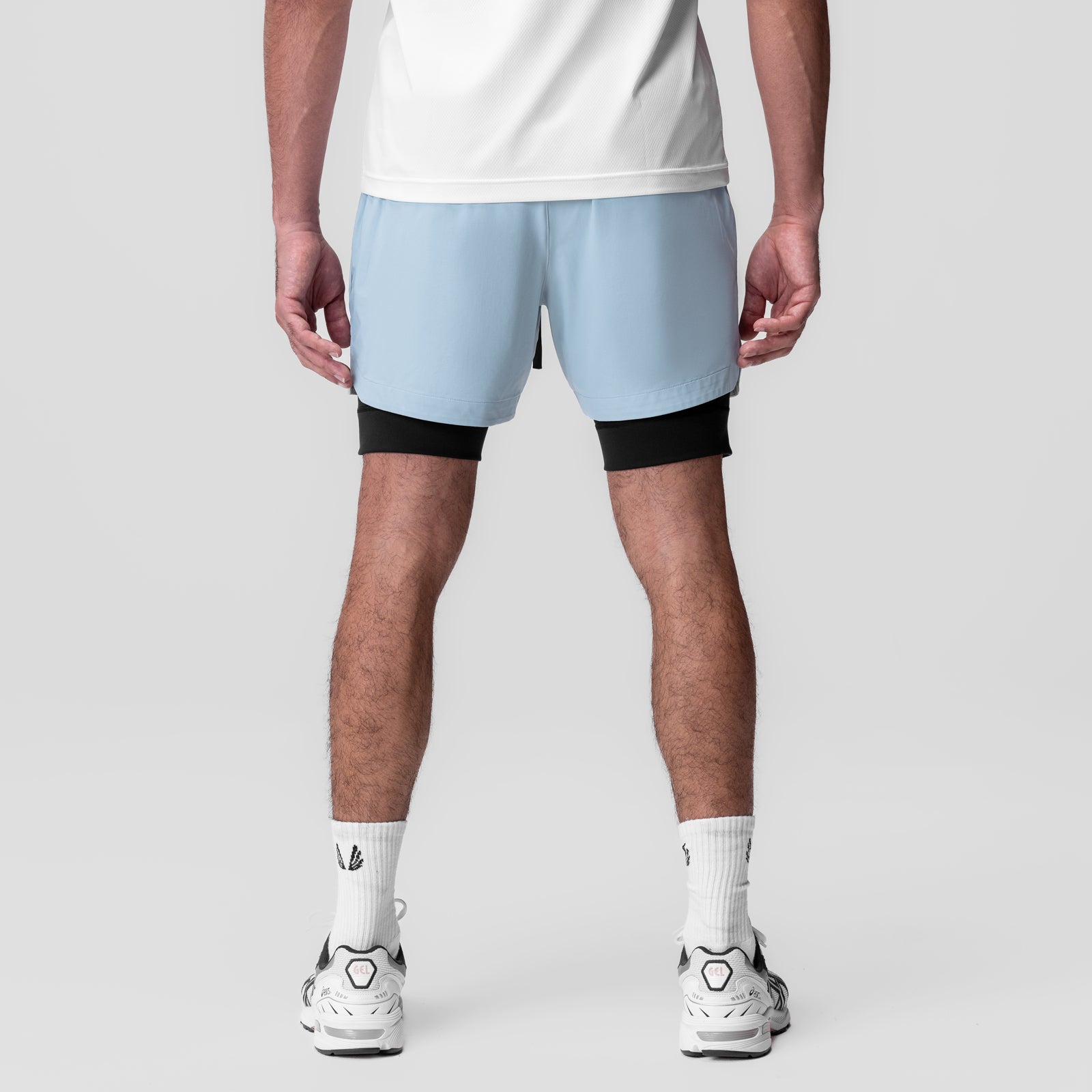Tetra-Lite Liner Short in light sky and black, rear view on model