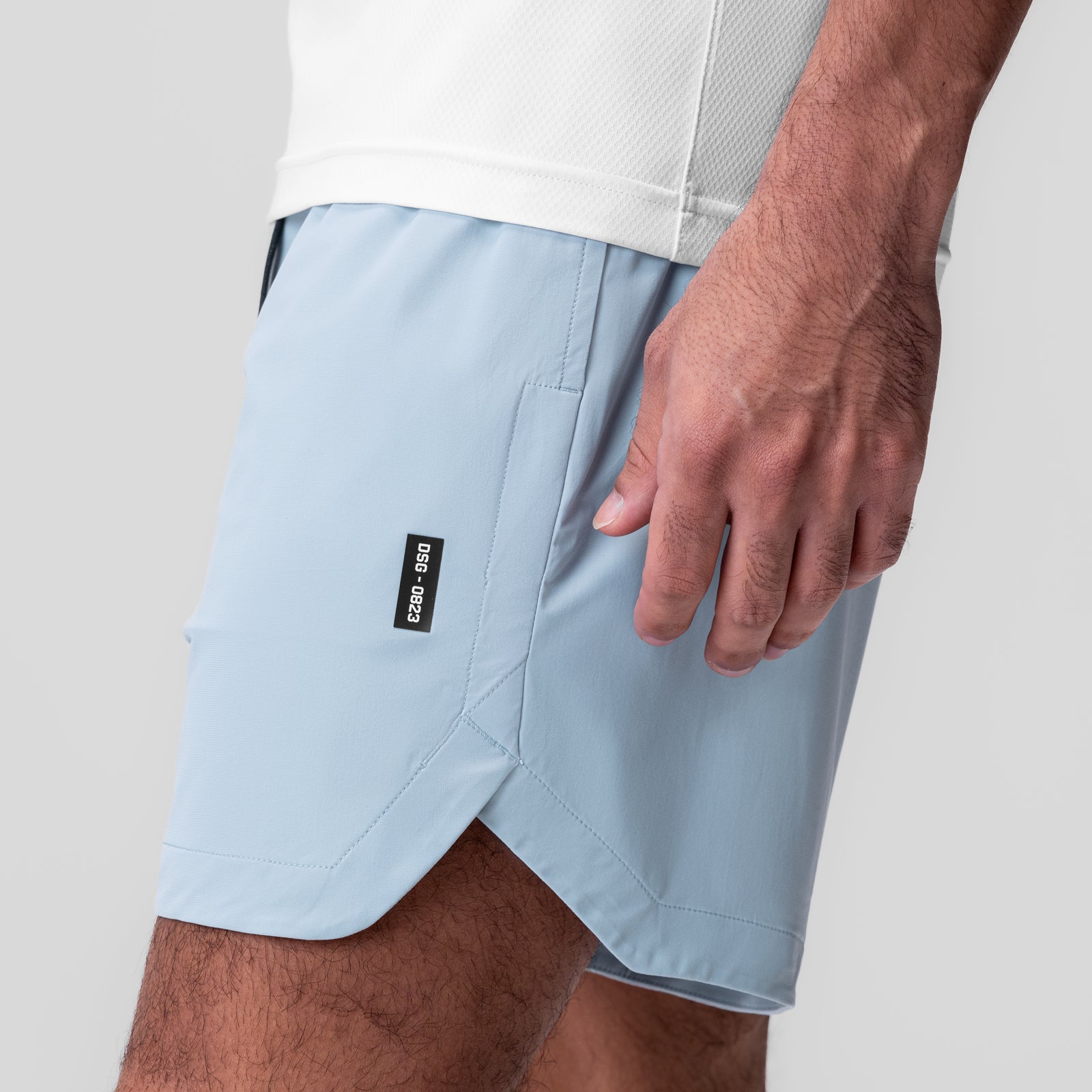 Tetra-Lite 7" Linerless Short in Light Sky, worn by model, side view
