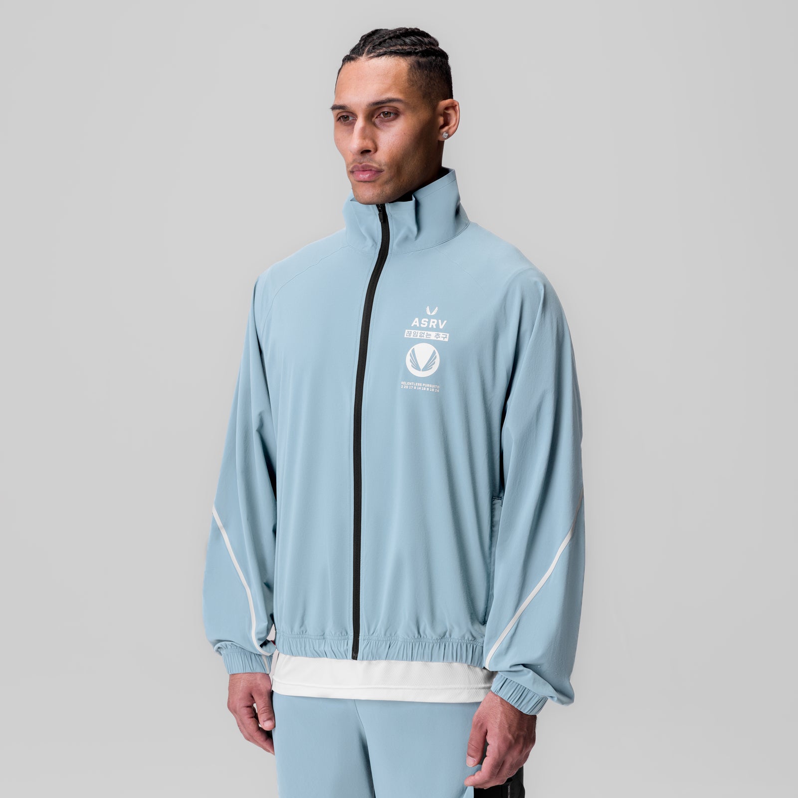 Aerotex Track Jacket in light sky blue worn by male model, front view