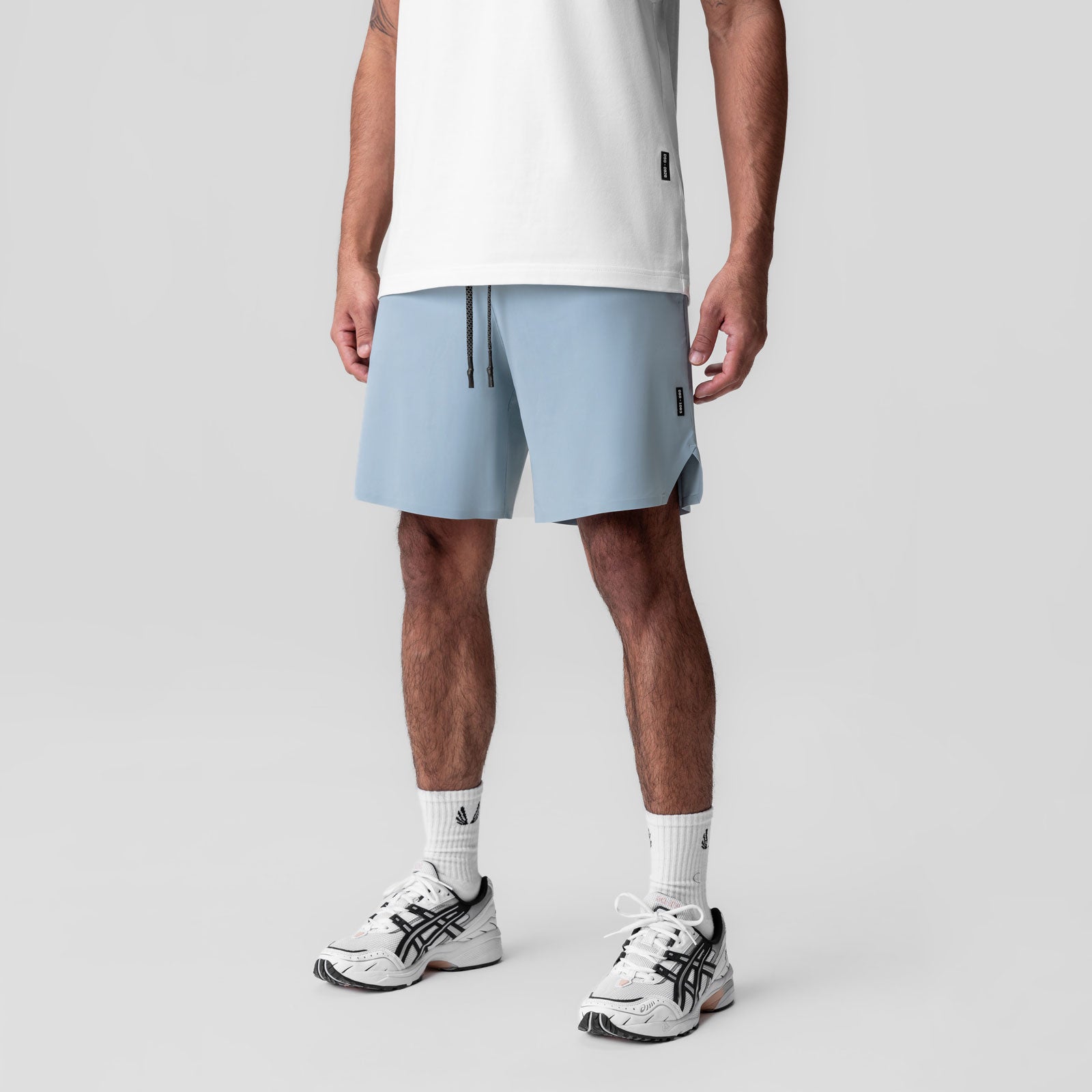 Revolutional Field Short in light sky blue, worn by model with white t-shirt and white sneakers