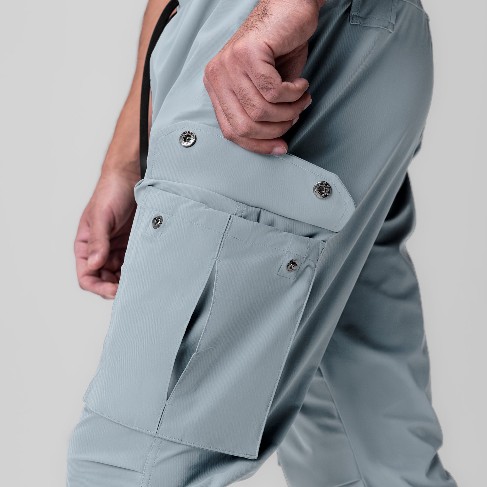 Tetra-Lite Ice Cargo High Rib Jogger in light sky, worn by model showing cargo pocket detail