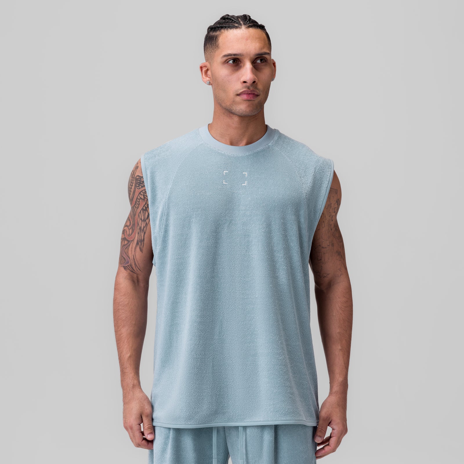 Towel Terry Cutoff sleeveless tank in light sky, worn by model facing forward