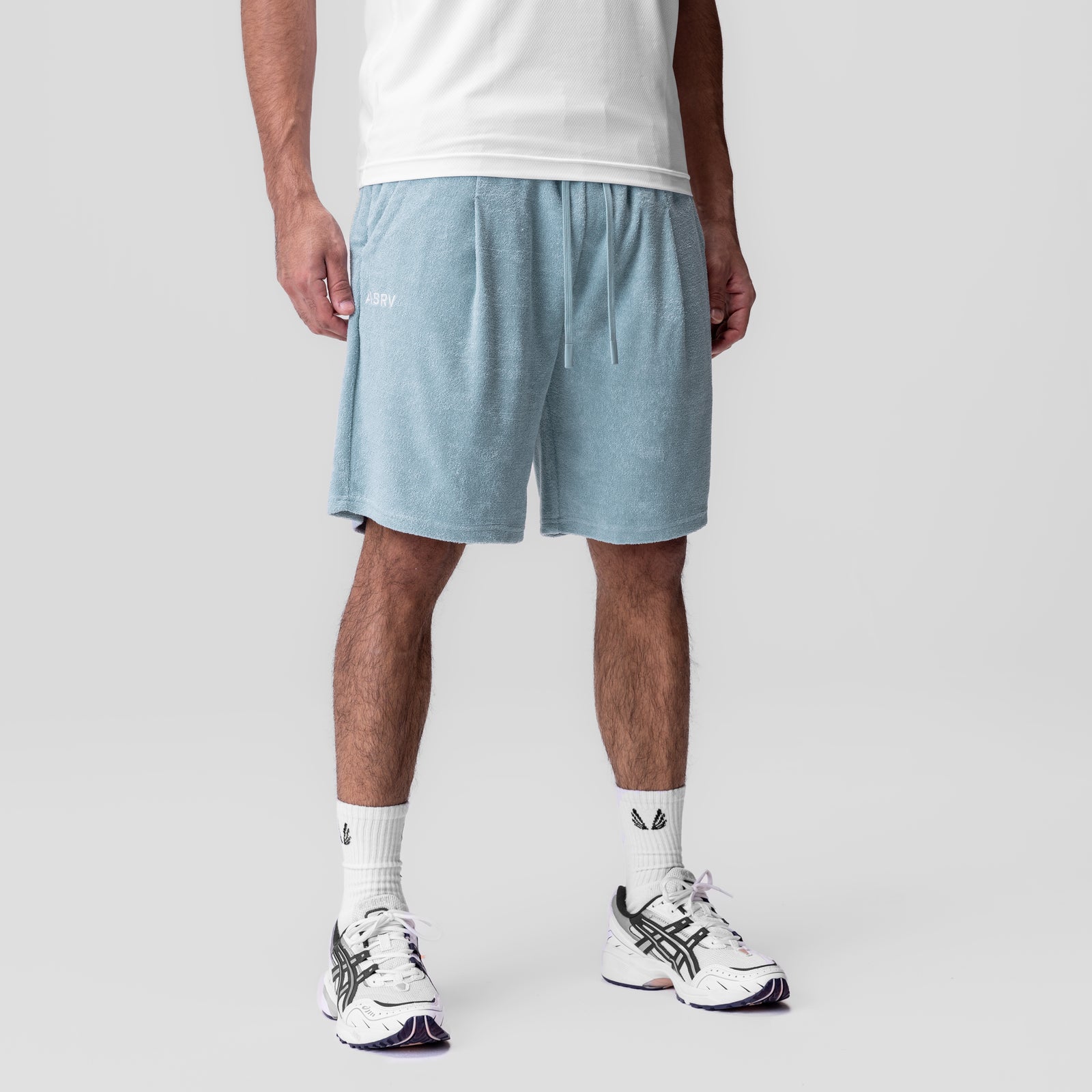 Towel Terry Relaxed Short in light sky blue, worn by model with white socks and sneakers