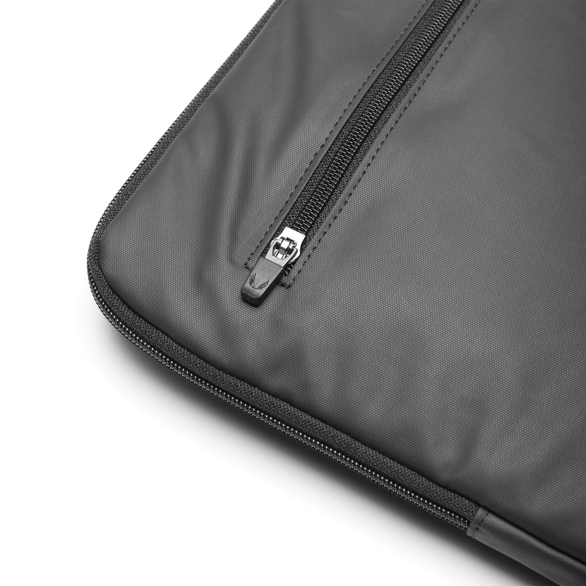 flatlay Water Resistant Padded Laptop Case in black, zipper detail closeup