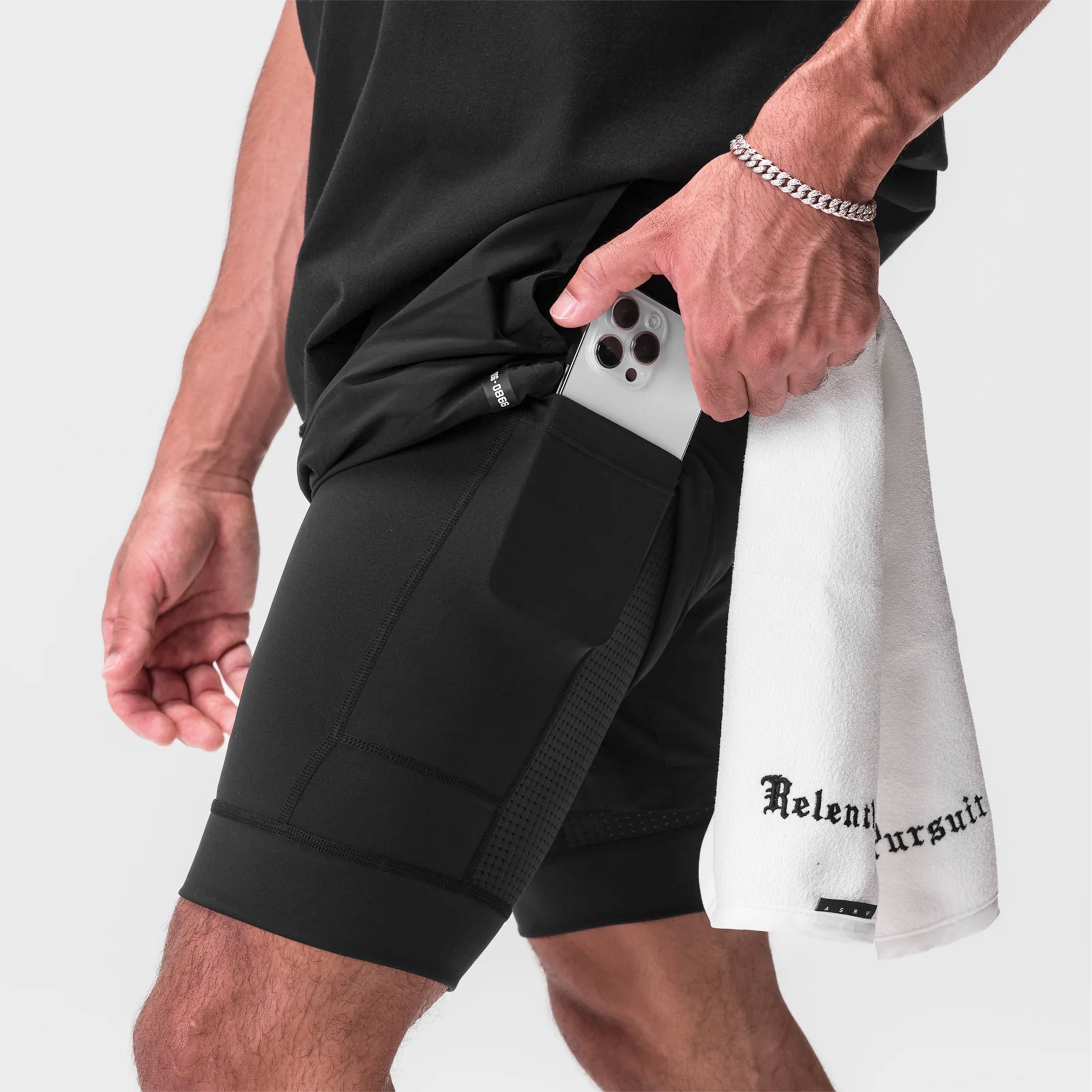 Tetra-Lite 7" Liner Short in black with white accent, worn by model holding phone in pocket