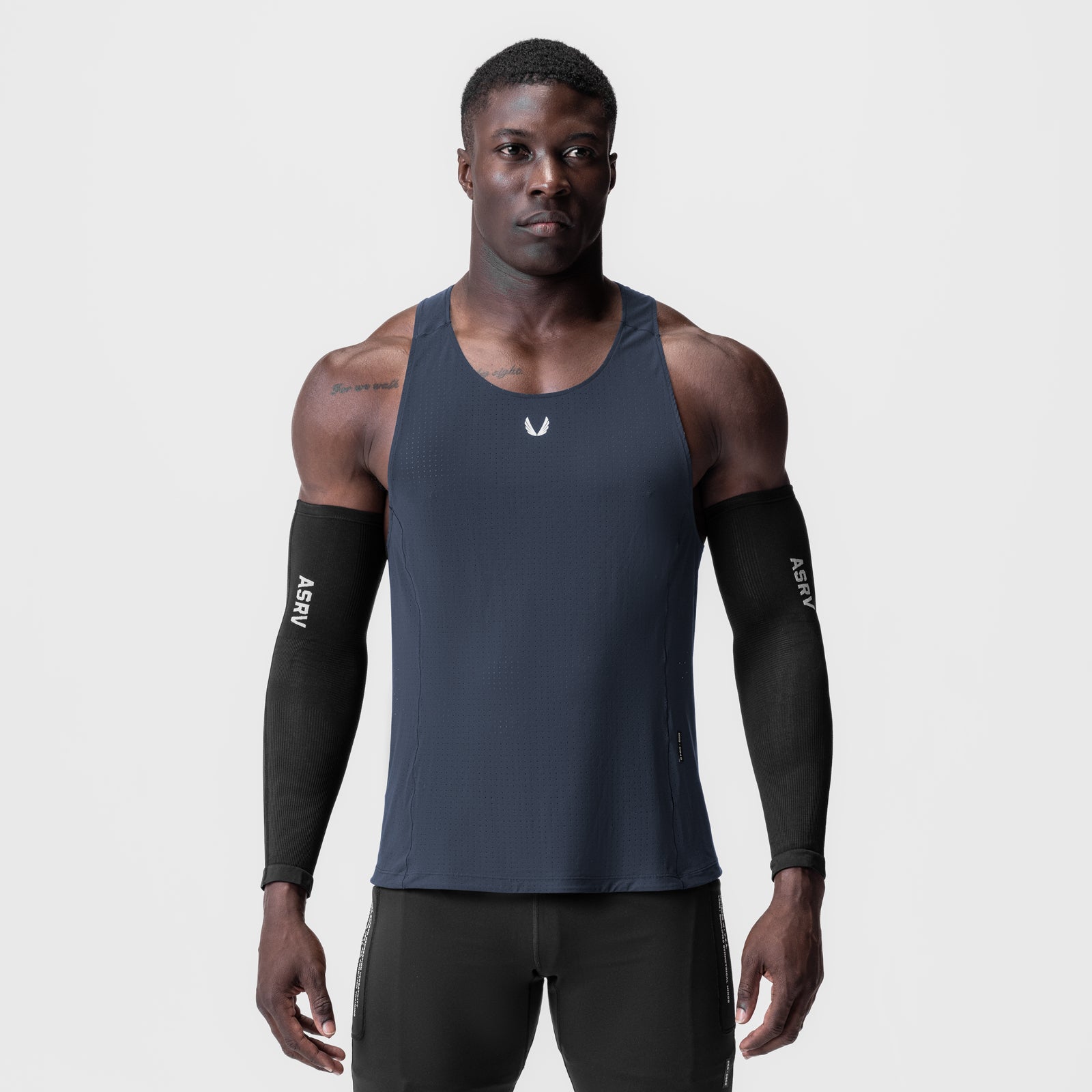 Laser-Vent™ Singlet Tank in navy worn by male model with black arm sleeves, front view