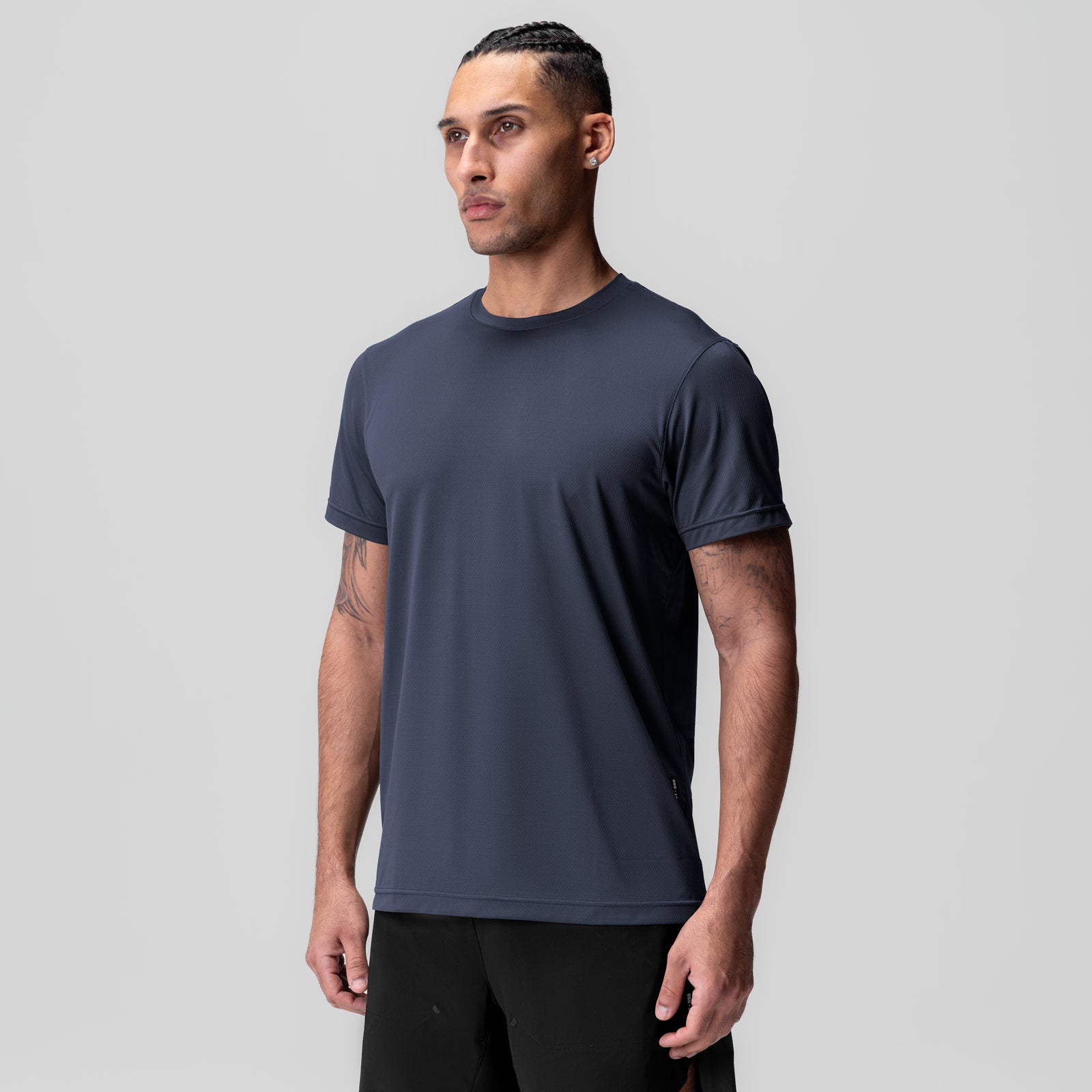 AeroSilver Essential Tee in navy, modeled on standing man, front view