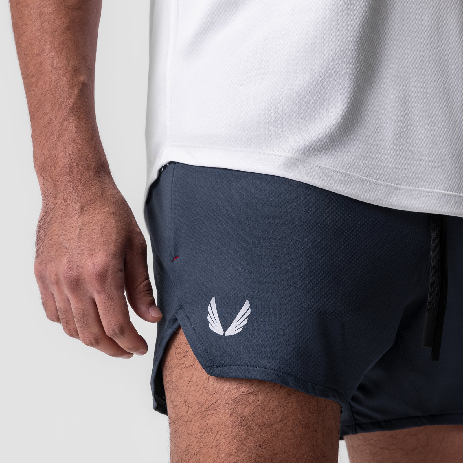 AeroSilver 5" Linerless Short in navy, worn by model, side view