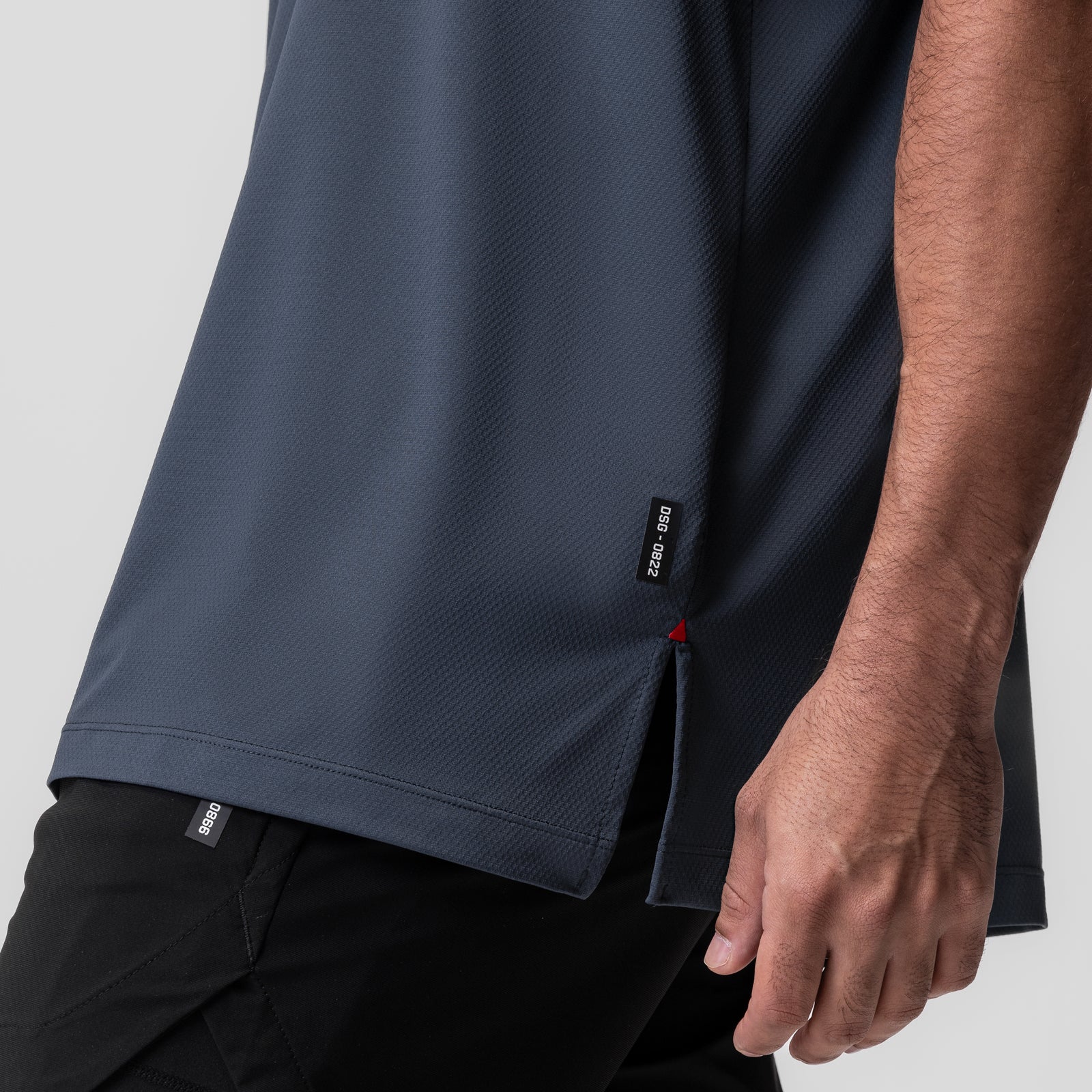 AeroSilver Oversized Tee in navy worn by model, side view detail