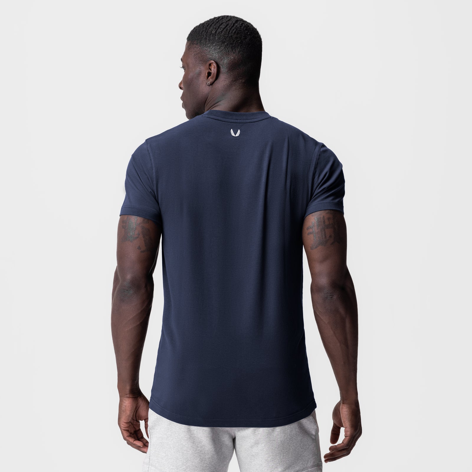 Navy Supima Essential Tee worn by model, back view