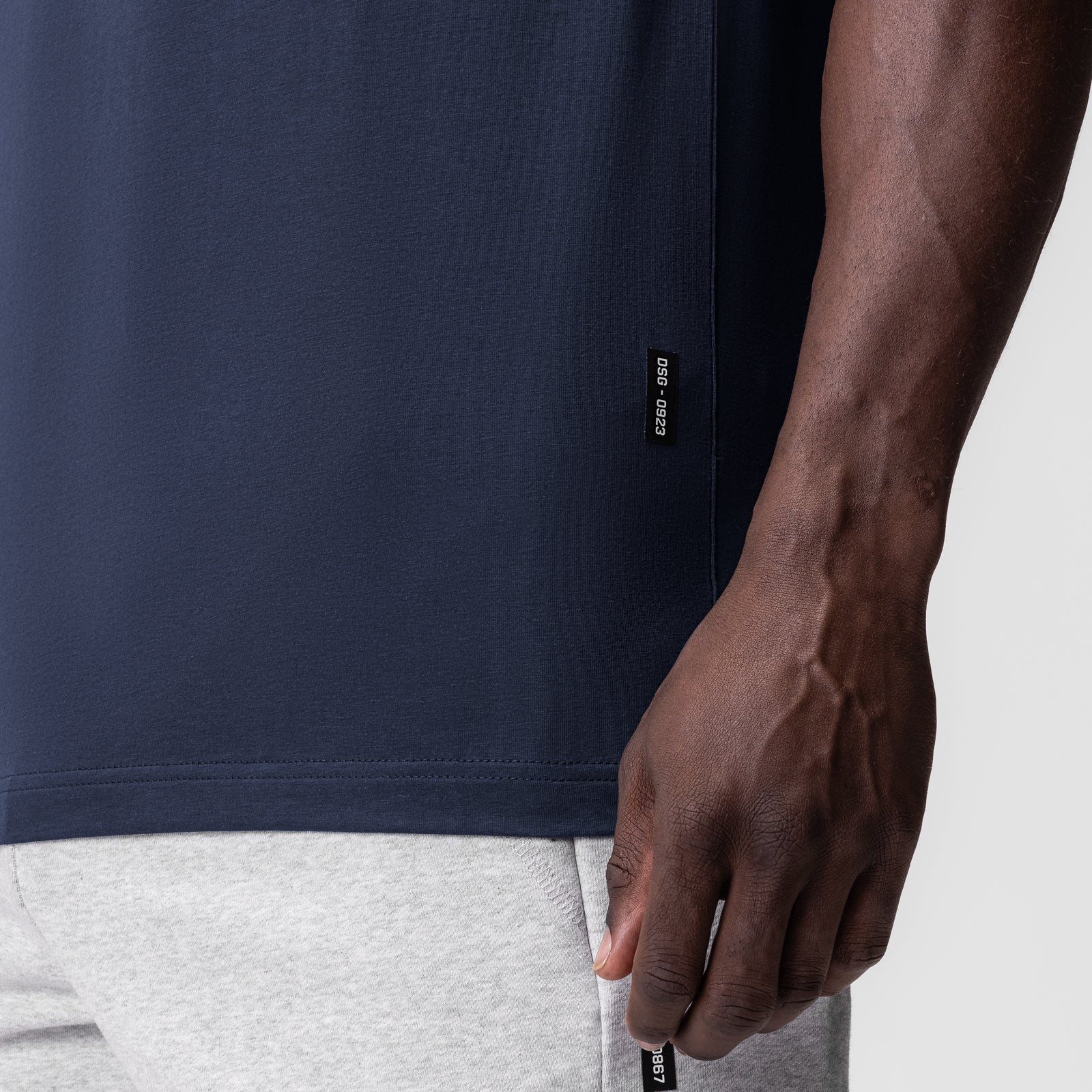 Navy Supima Essential Tee worn by model, side detail view showing fit and fabric