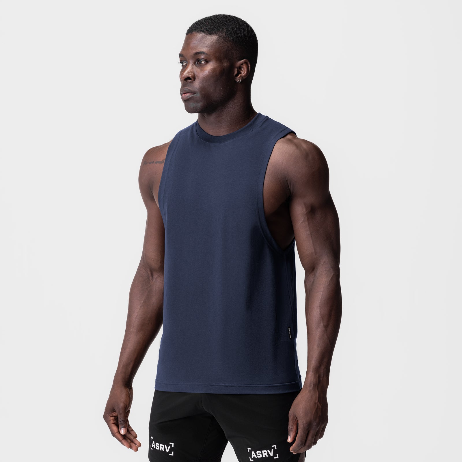 Navy Supima® Muscle Tank worn by model, side view